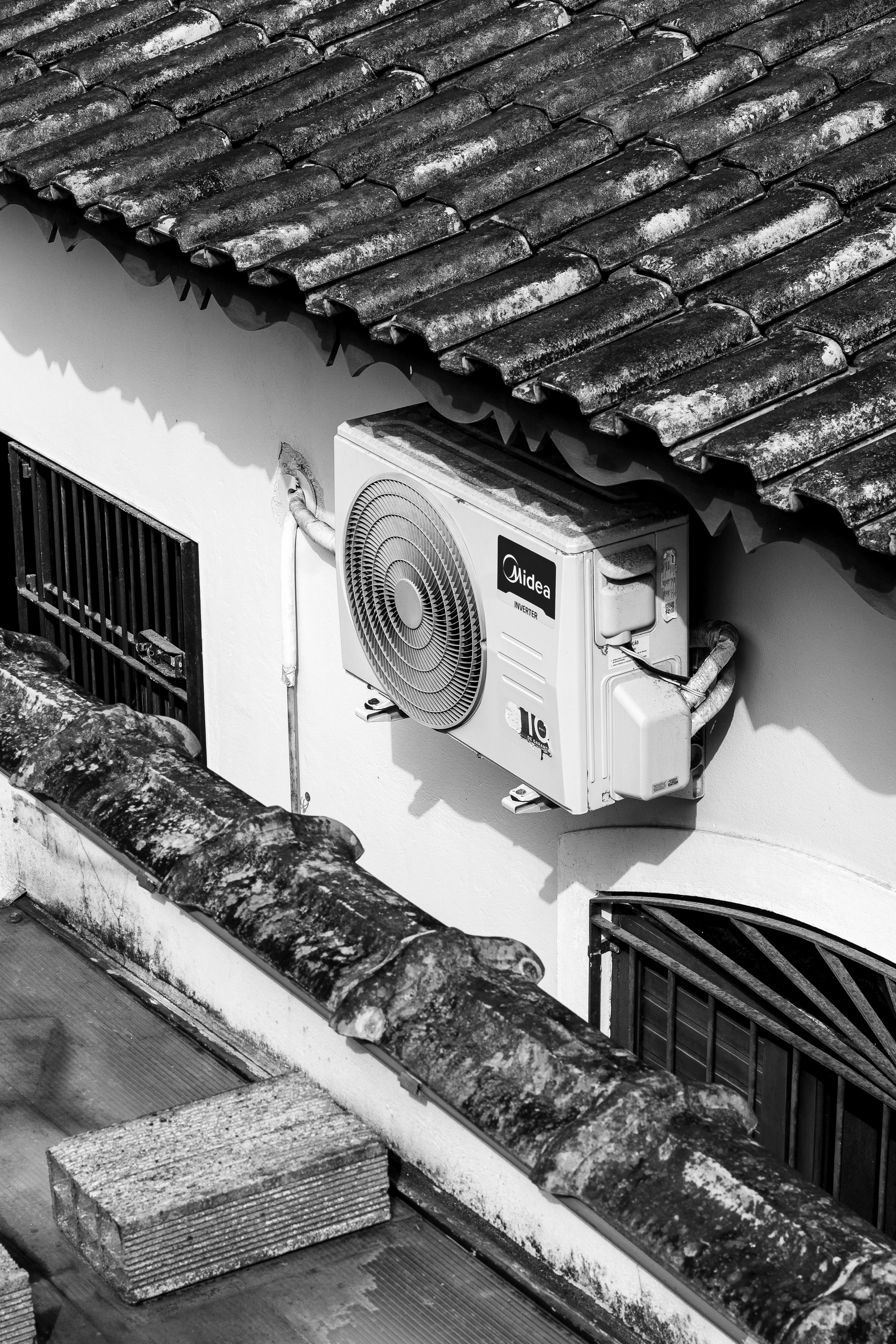 Outdoor AC condenser unit on a building