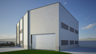 Modern industrial building with large garage door.