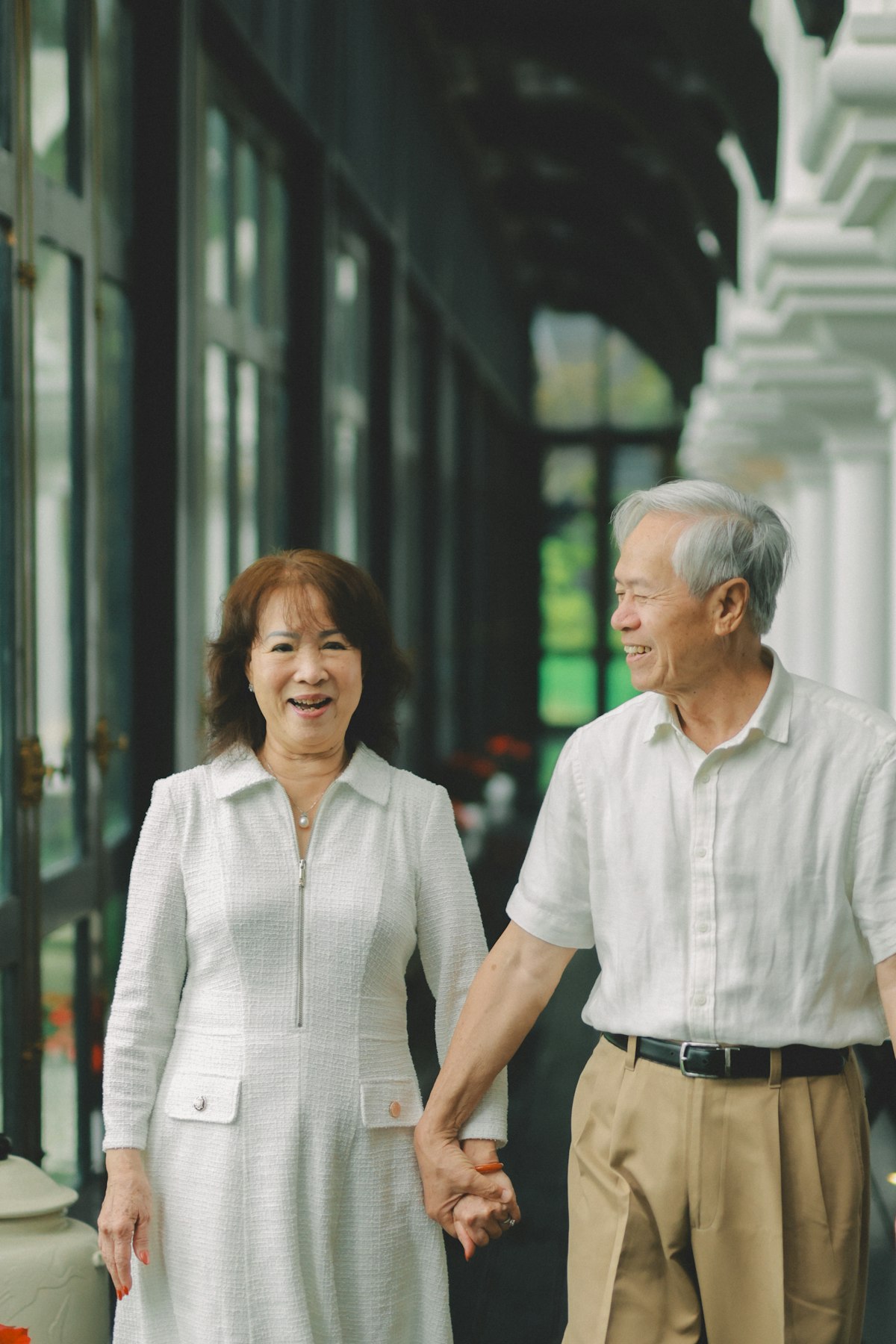 Elderly couple holding hands representing Social Security beneficiaries