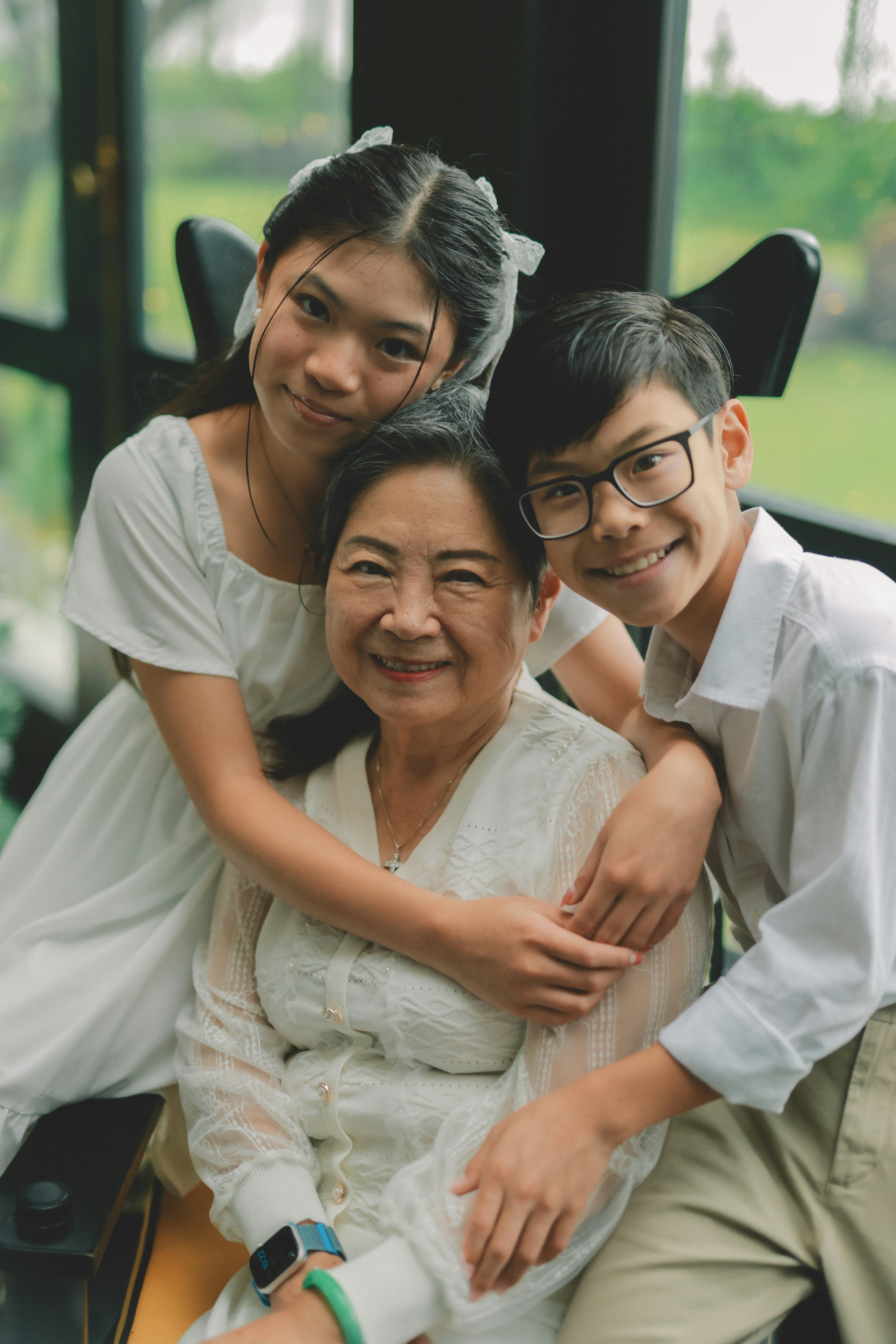 Grandmother with her grandchildren smiling together