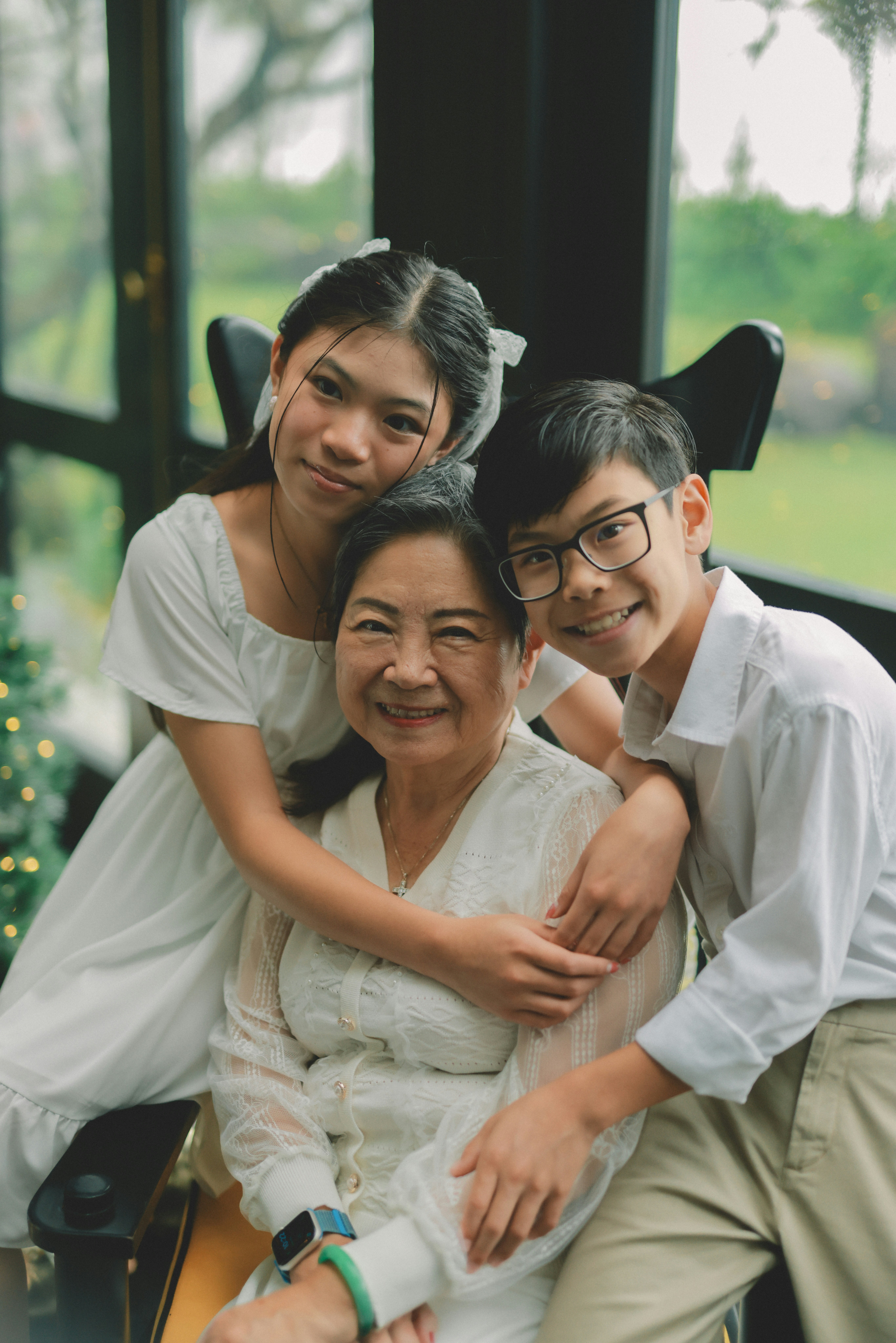 Grandmother with her two grandchildren smiling