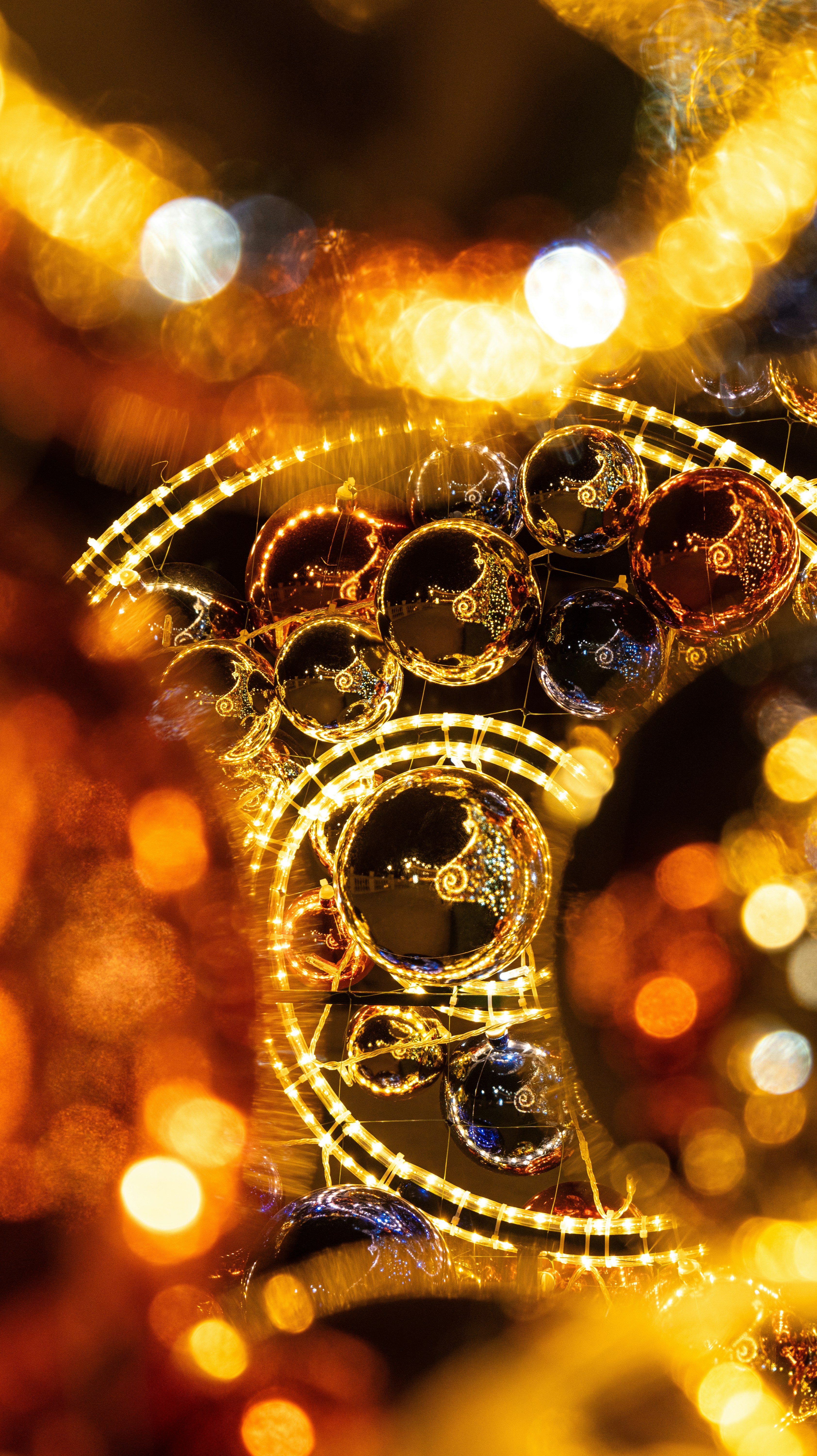 Golden christmas lights and ornaments sparkle
