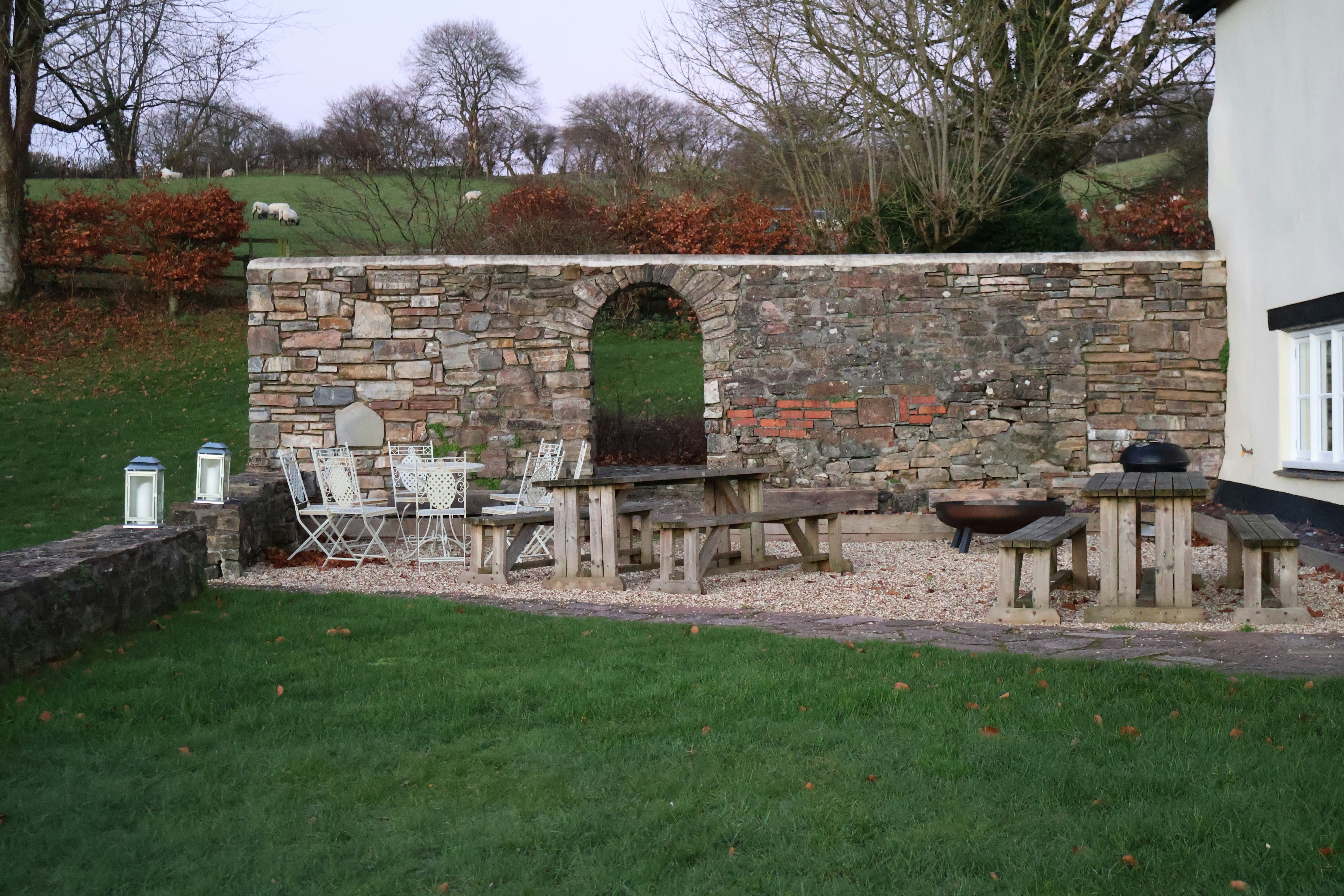 Stone-walled patio with outdoor seating