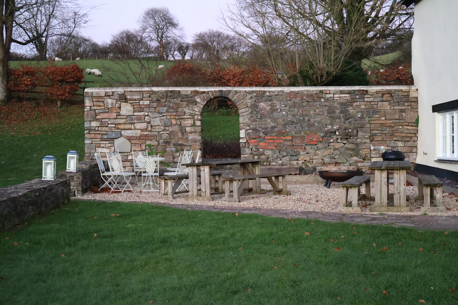 Landscaped stone patio set for evening use