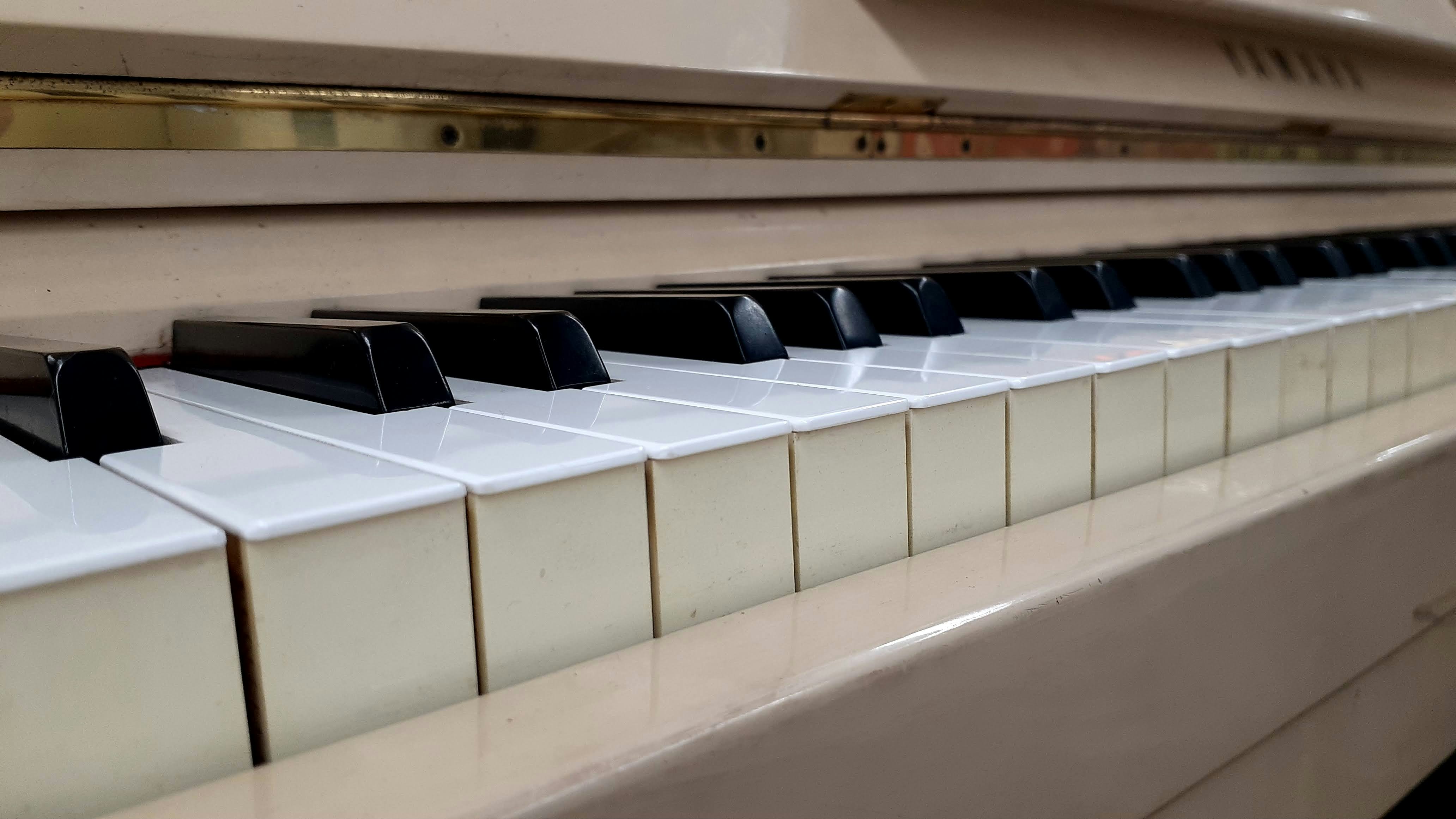 Close-up of a piano keyboard with white keys