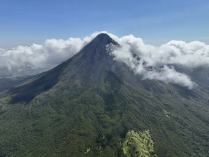 A majestic volcano covered in lush green vegetation.