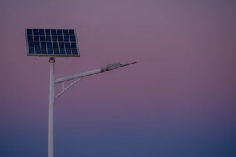 Solar panel street lamp against a twilight sky