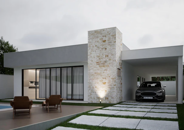 Modern house with a car in the driveway.