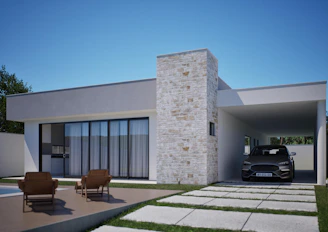 Casa moderna com garagem e área de estar externa.