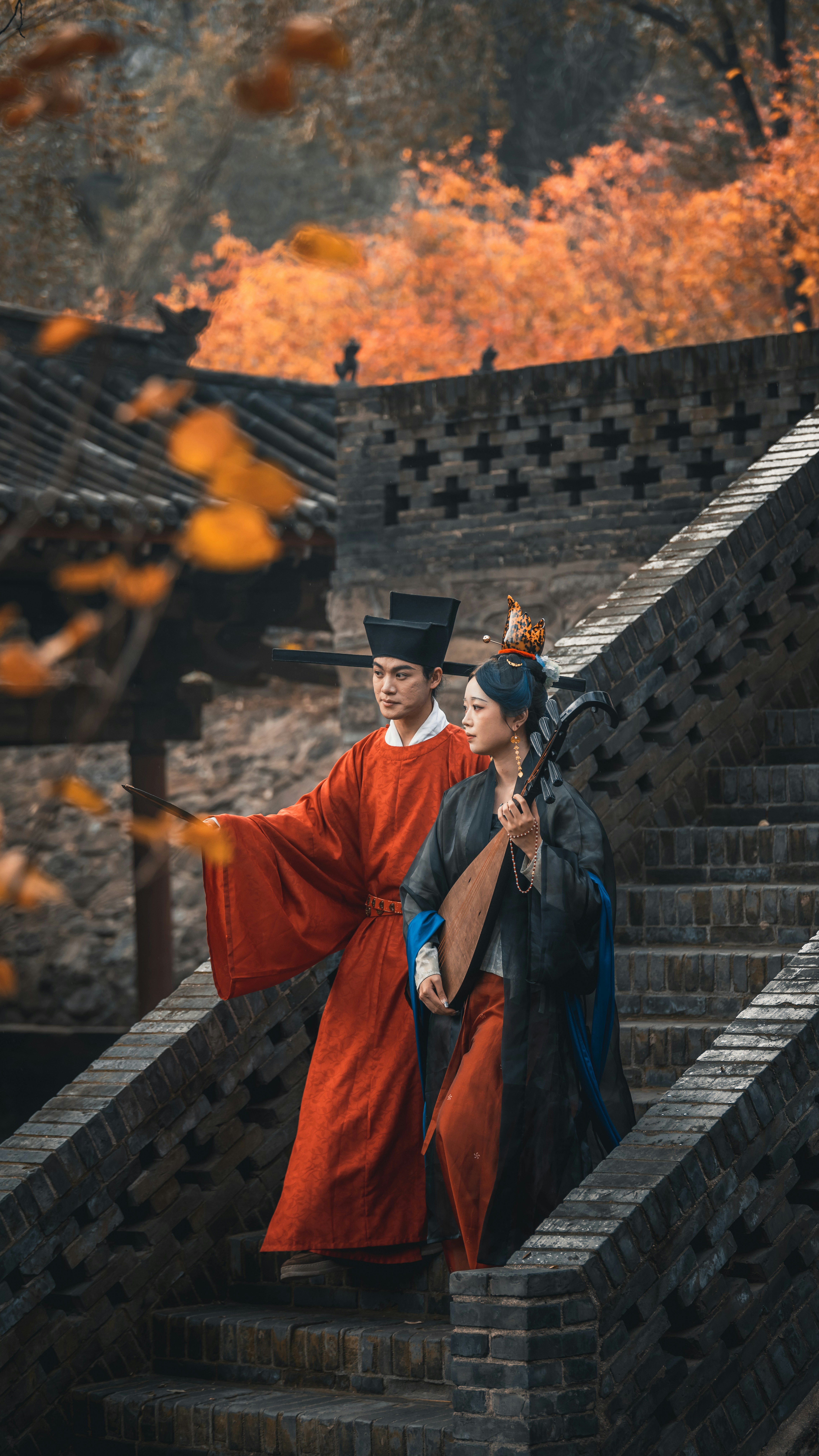 Couple in traditional chinese clothing on stone stairs