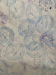 Blue stamps with bird motifs scattered on textured paper
