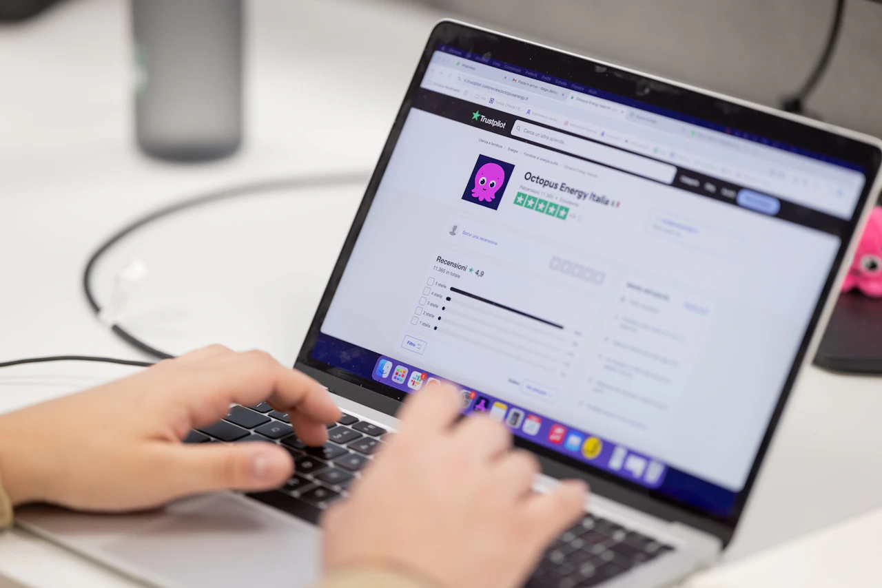 Someone typing a reply on a laptop, the same-day response habit that turns a critical review into evidence of a responsive team