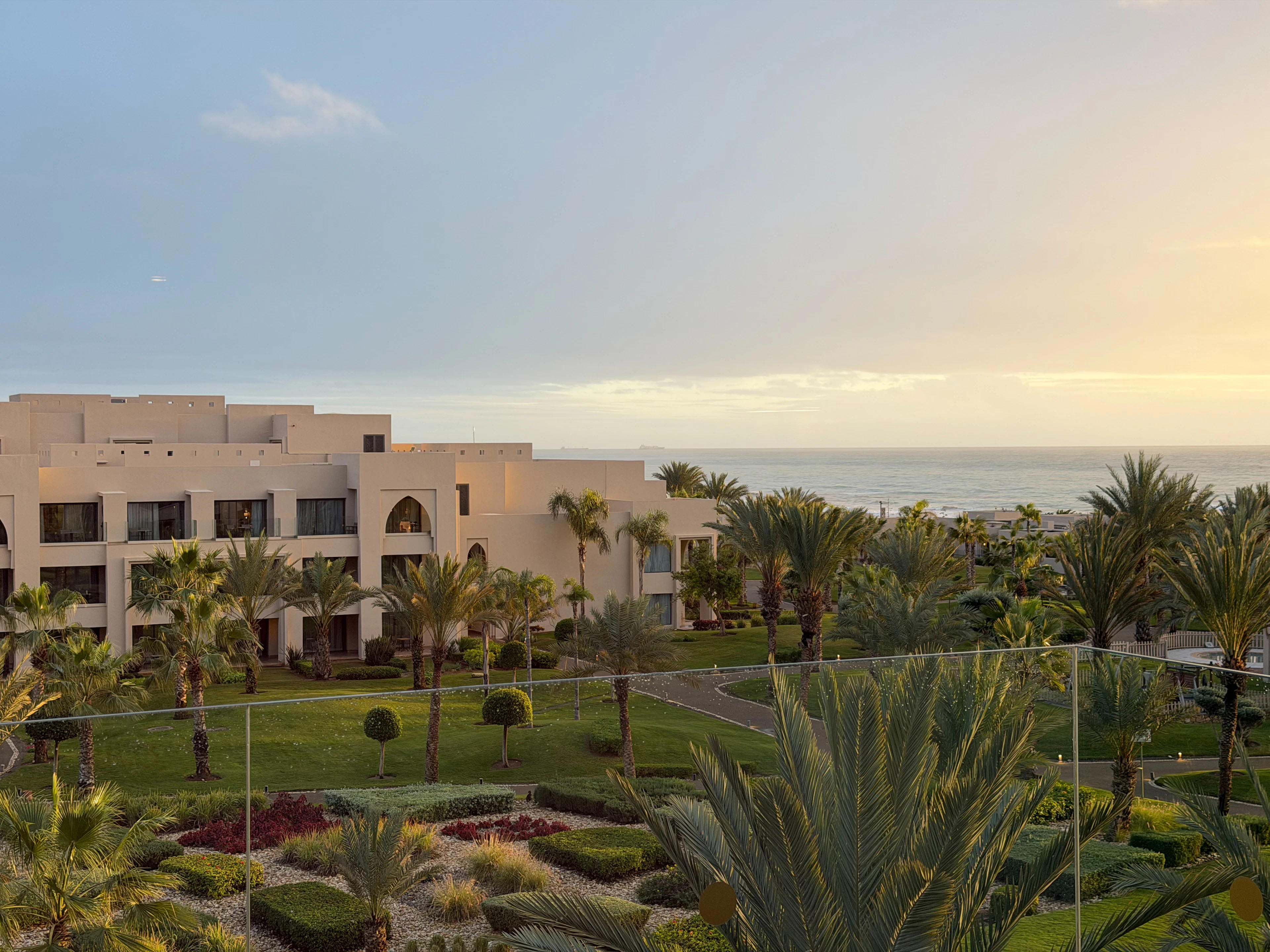 Resort by the ocean at sunset
