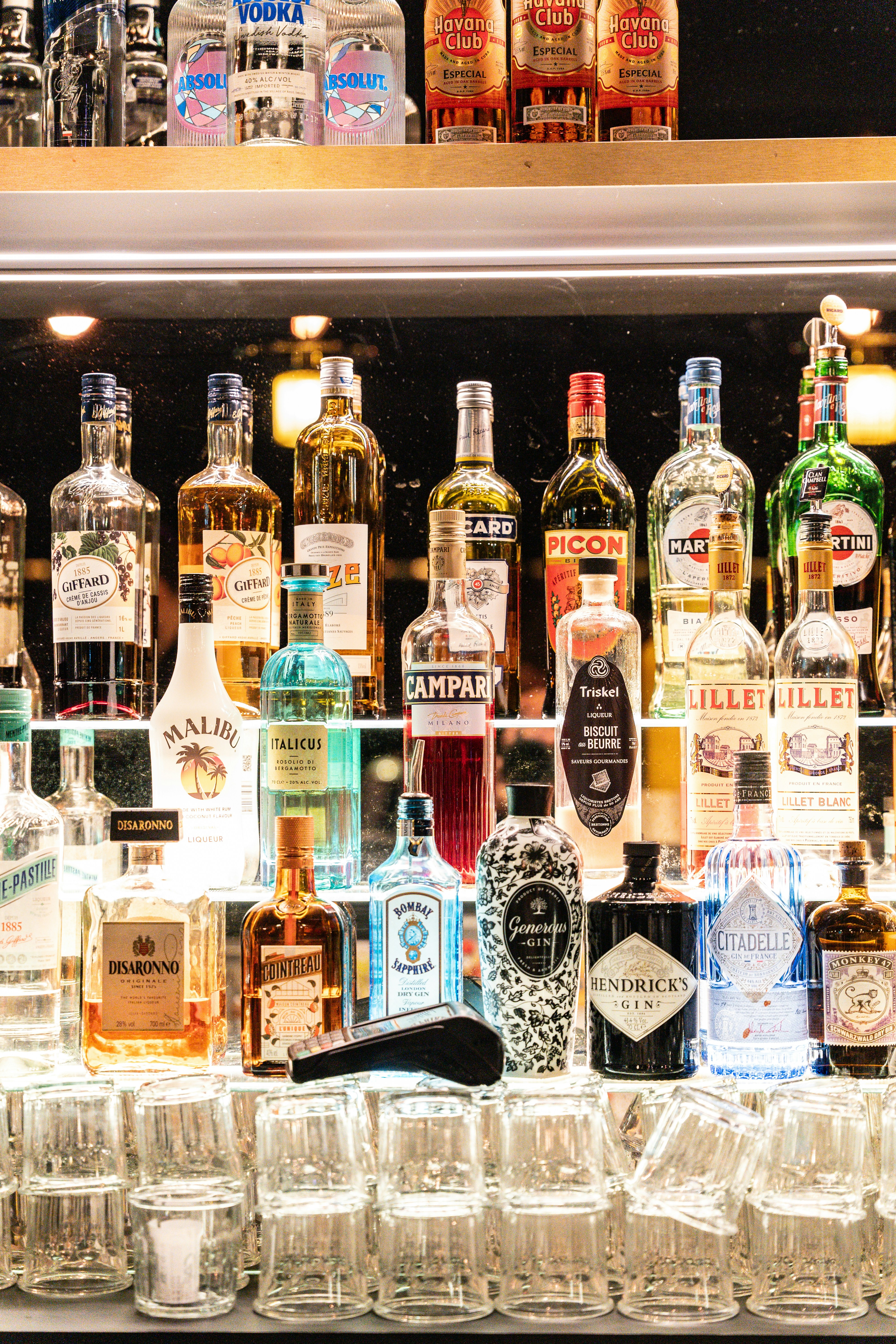 Variety of liquor bottles displayed on shelves.