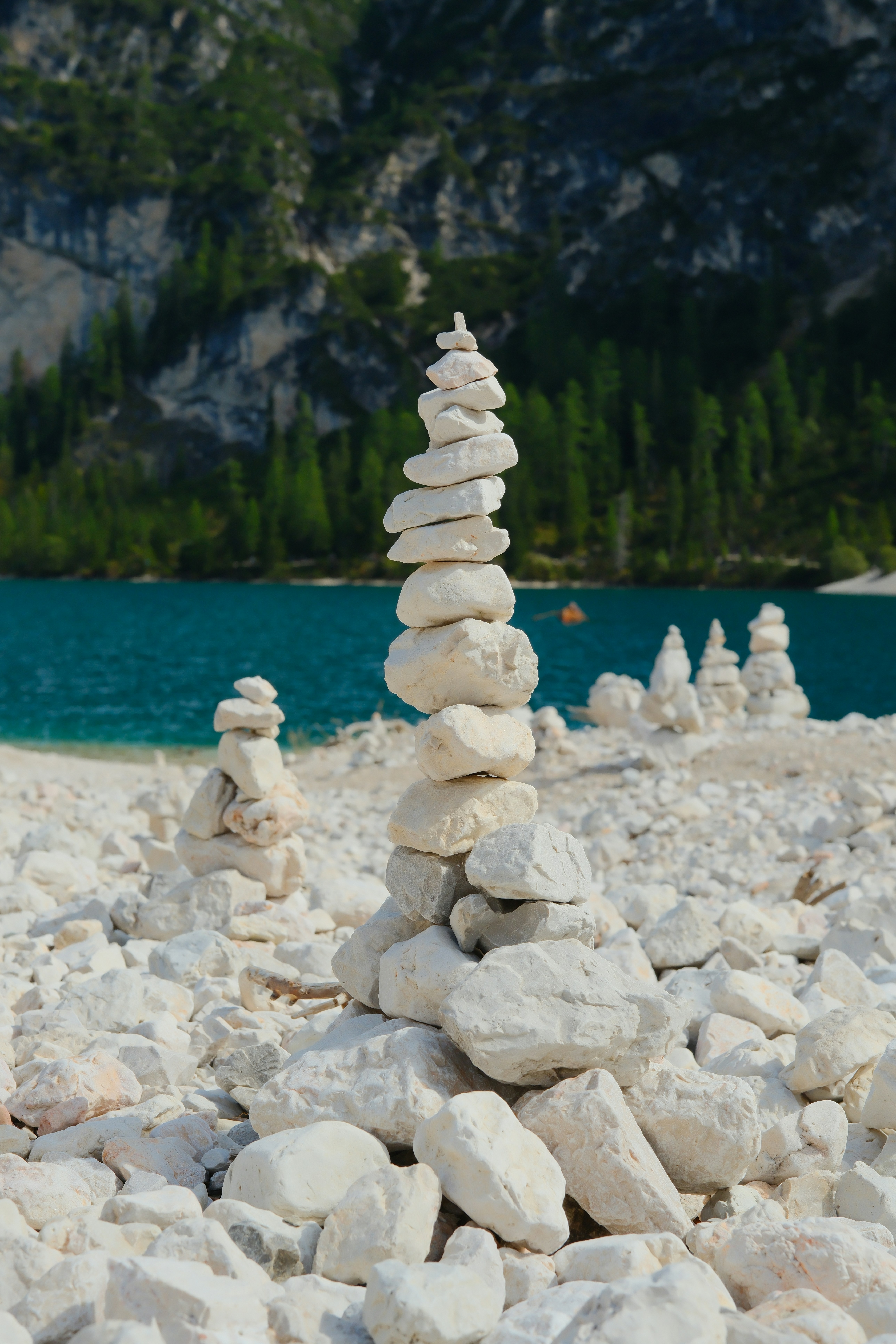 Stack of white stones on a rocky shore