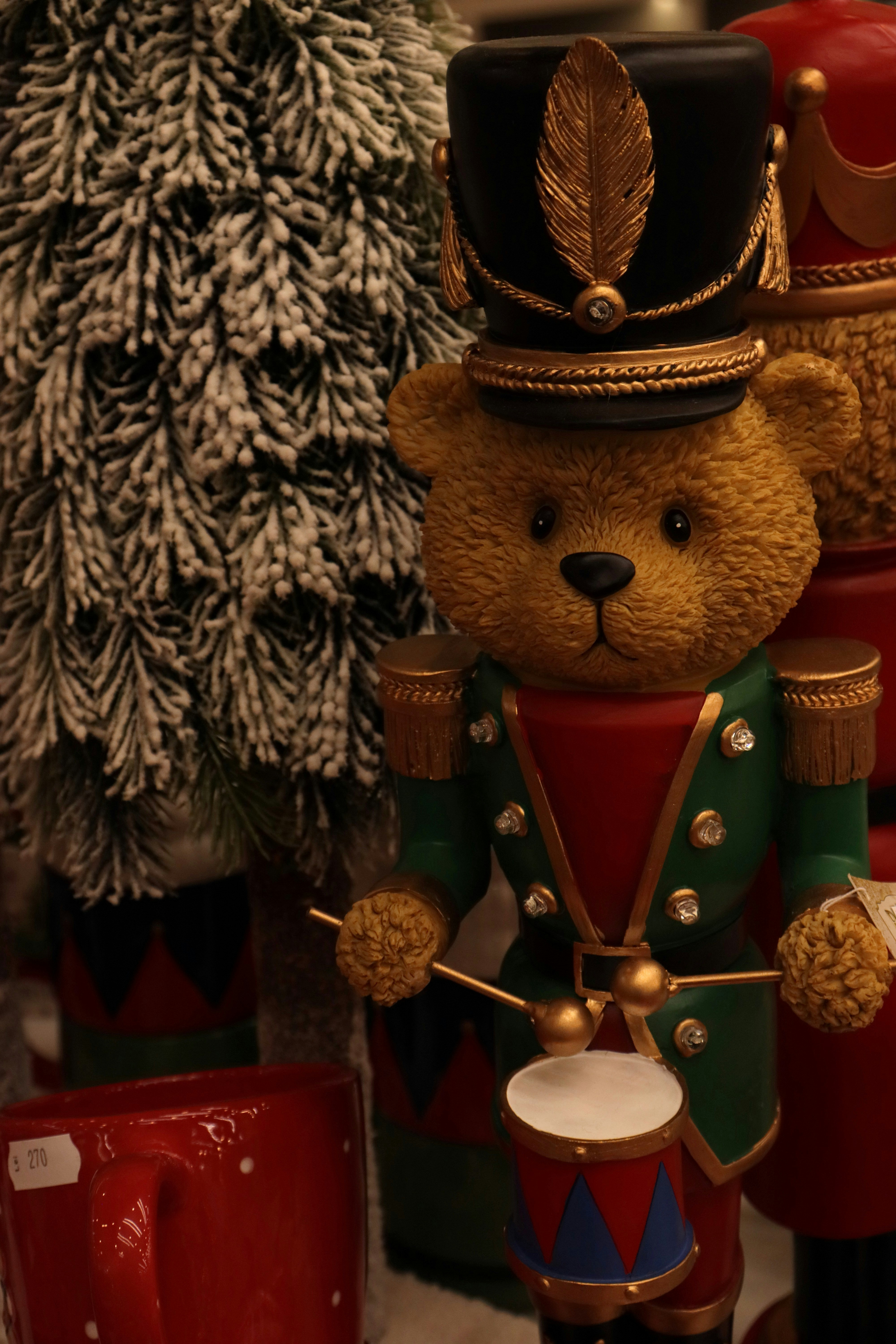 Teddy bear drummer in a nutcracker uniform