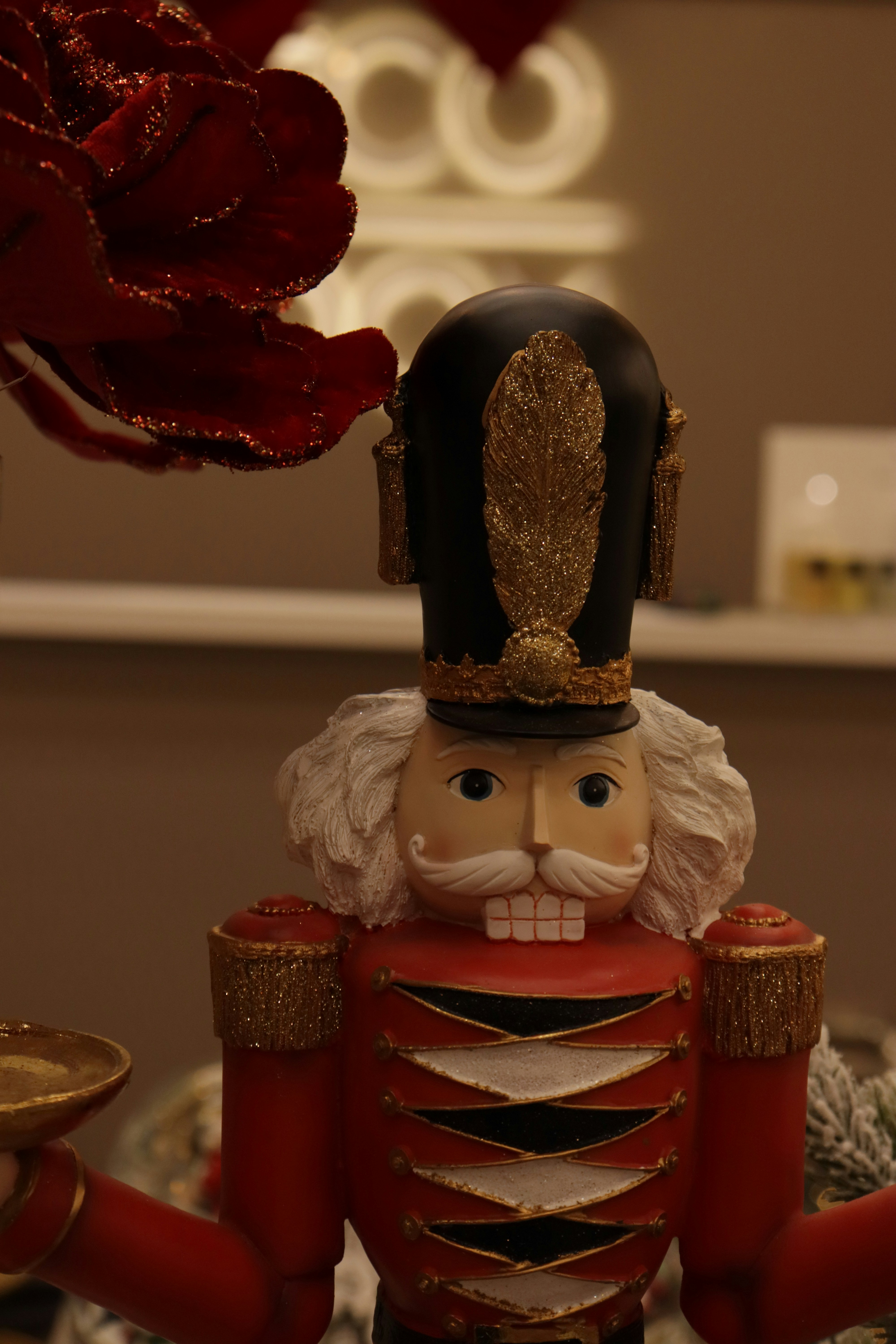 A festive nutcracker soldier decoration with red uniform