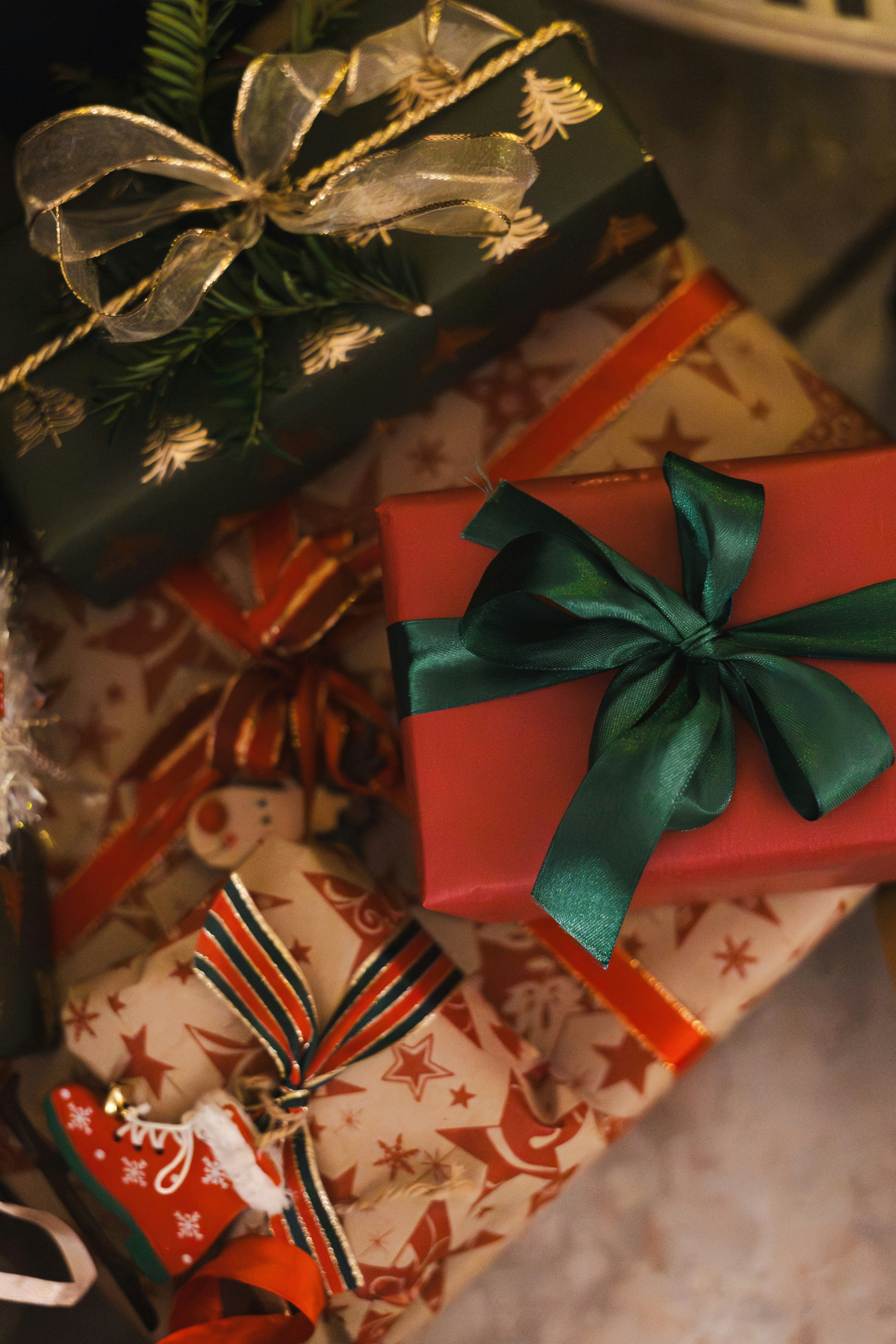 Stack of festive christmas presents with ribbons.