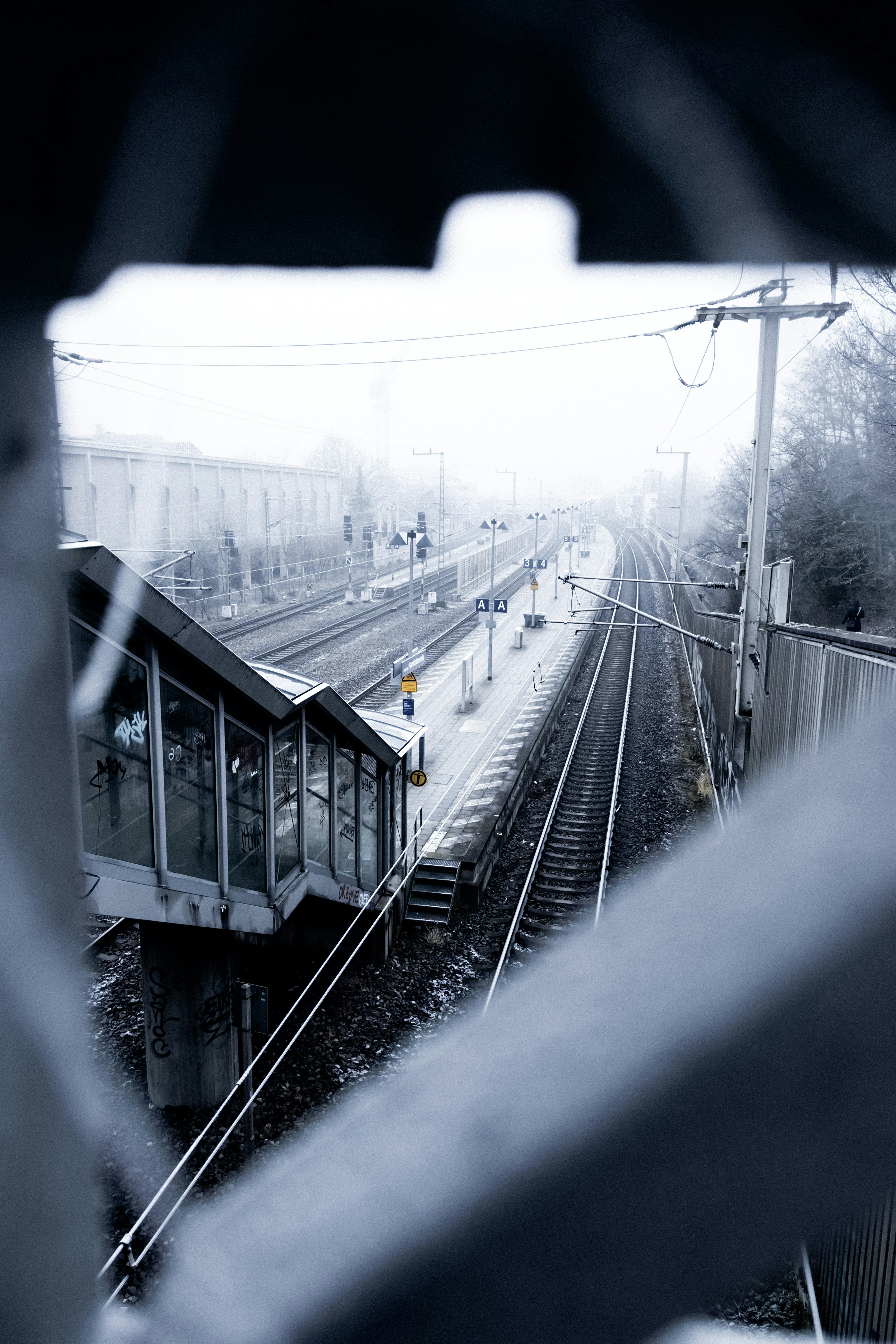 Train station tracks on a foggy day