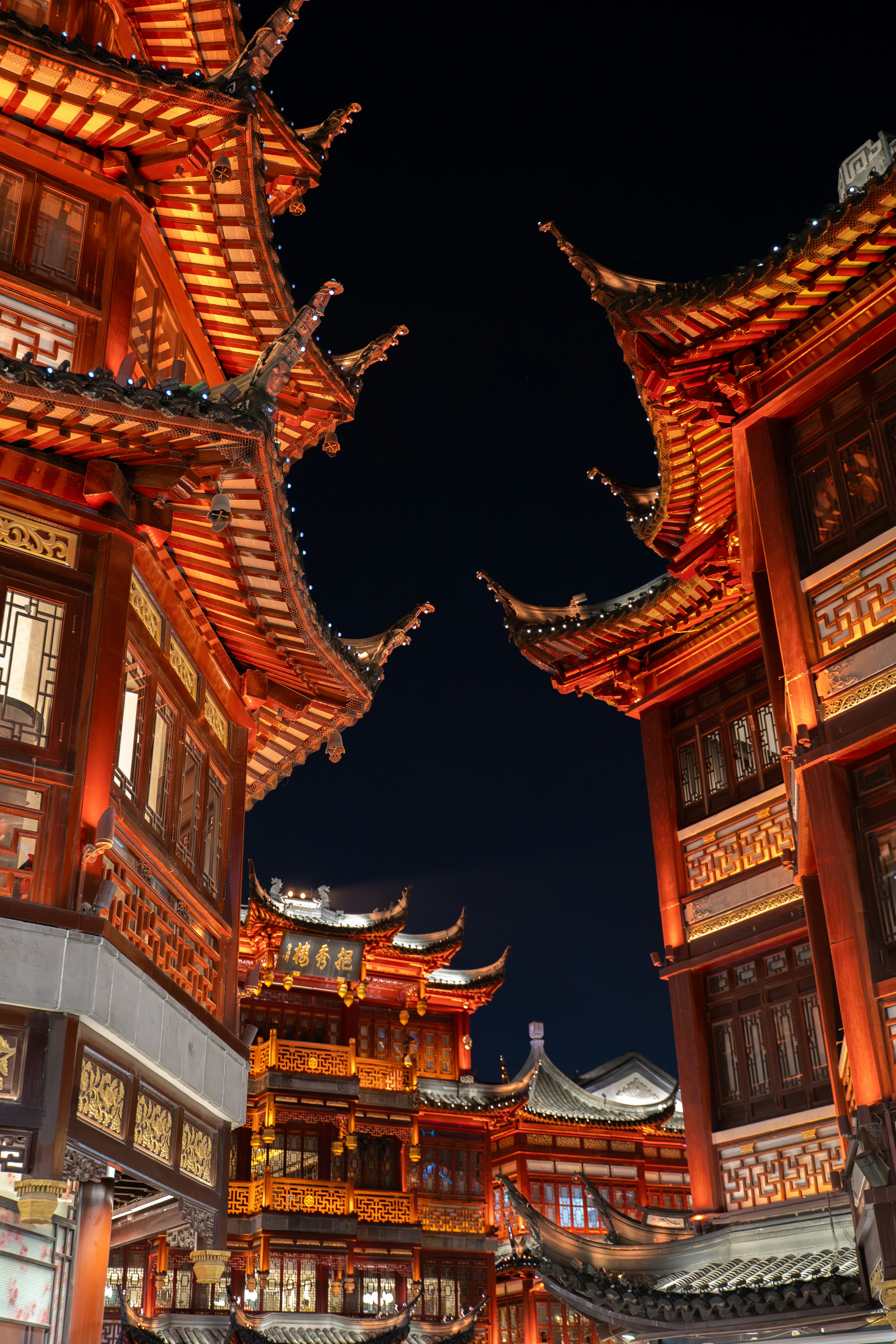 Ornate traditional chinese buildings illuminated at night