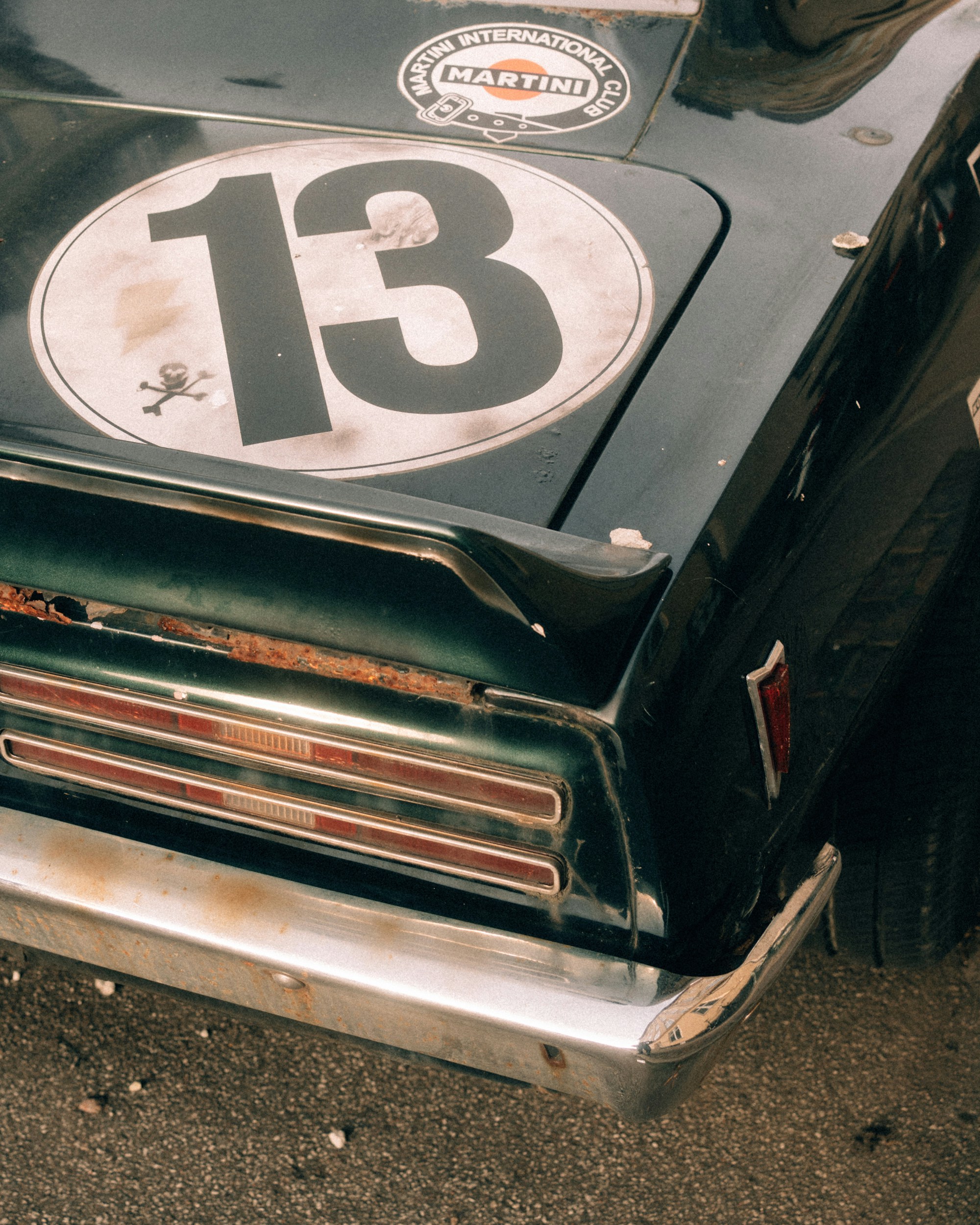 Vintage race car with number 13 emblem