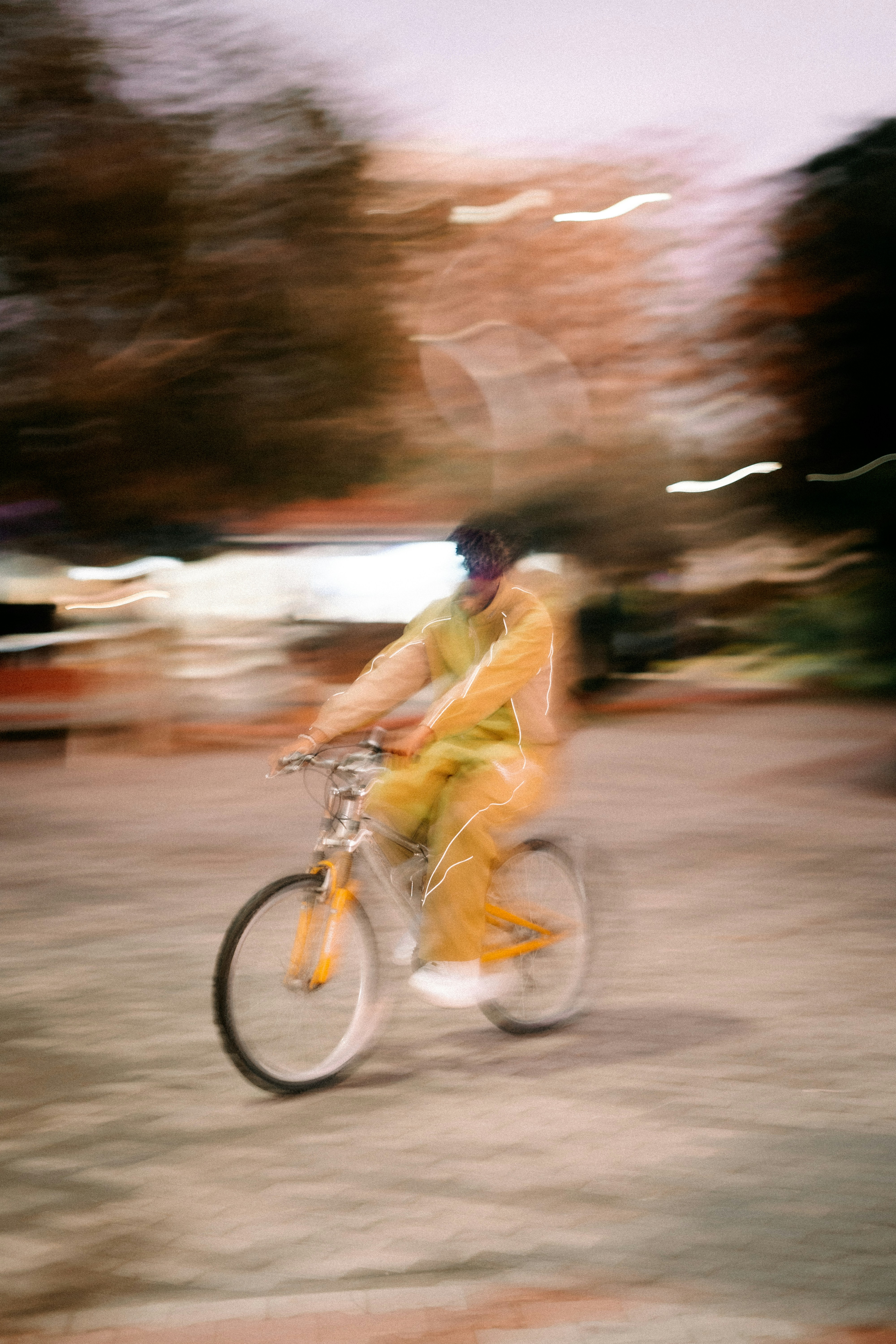 Person riding a bicycle with motion blur