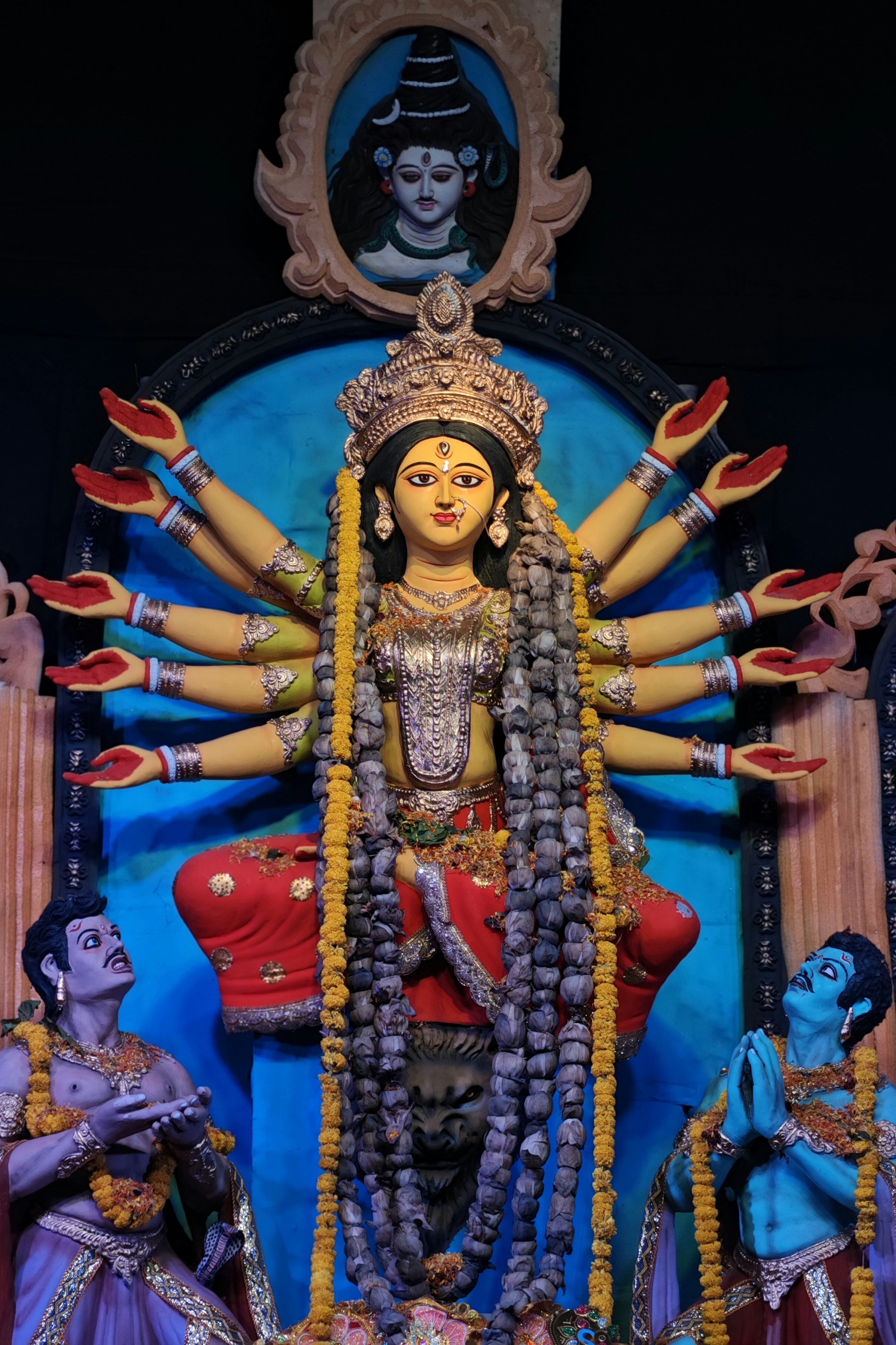 Goddess durga with multiple arms and attendants
