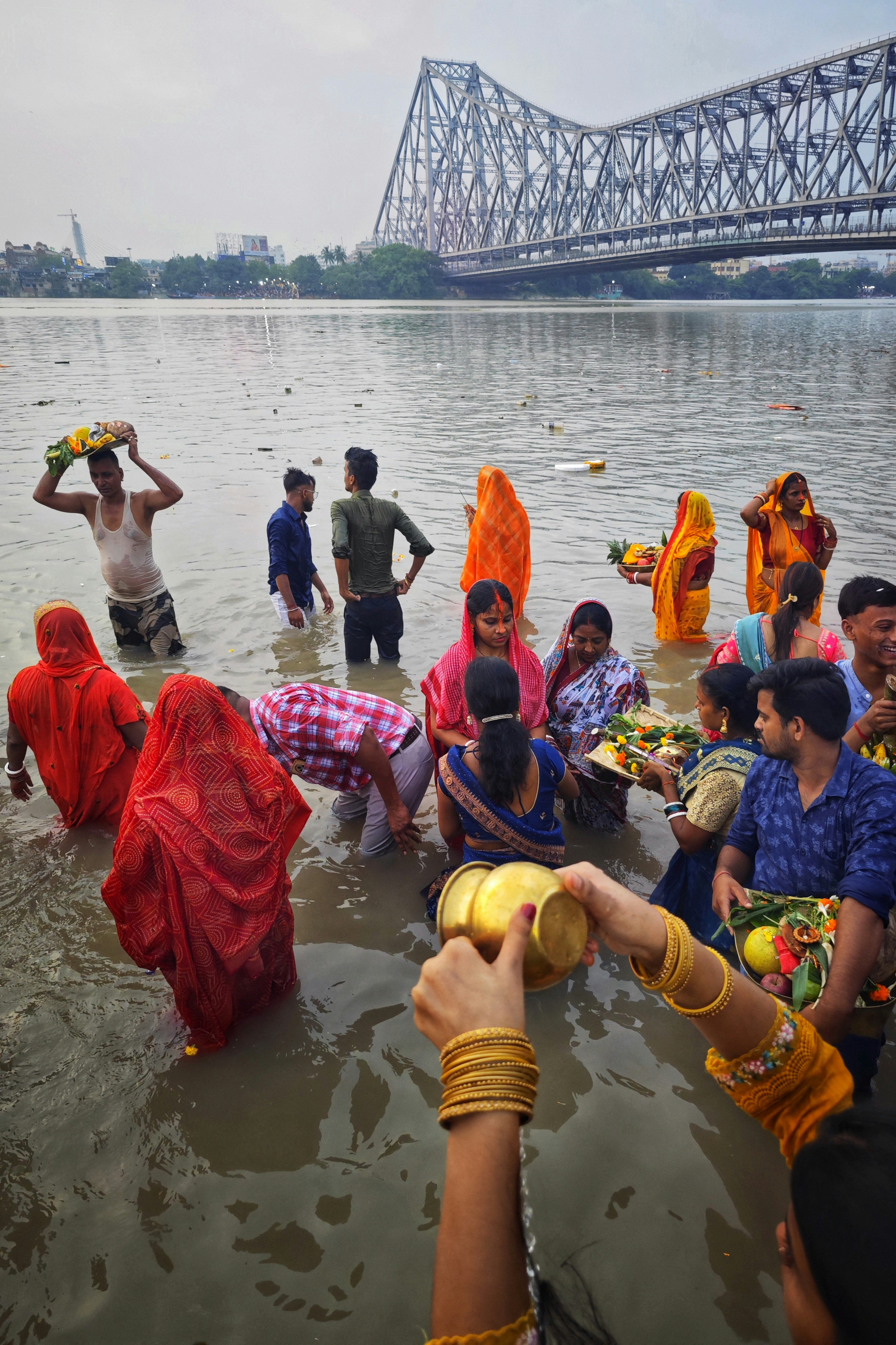 People performing a ritual in a river