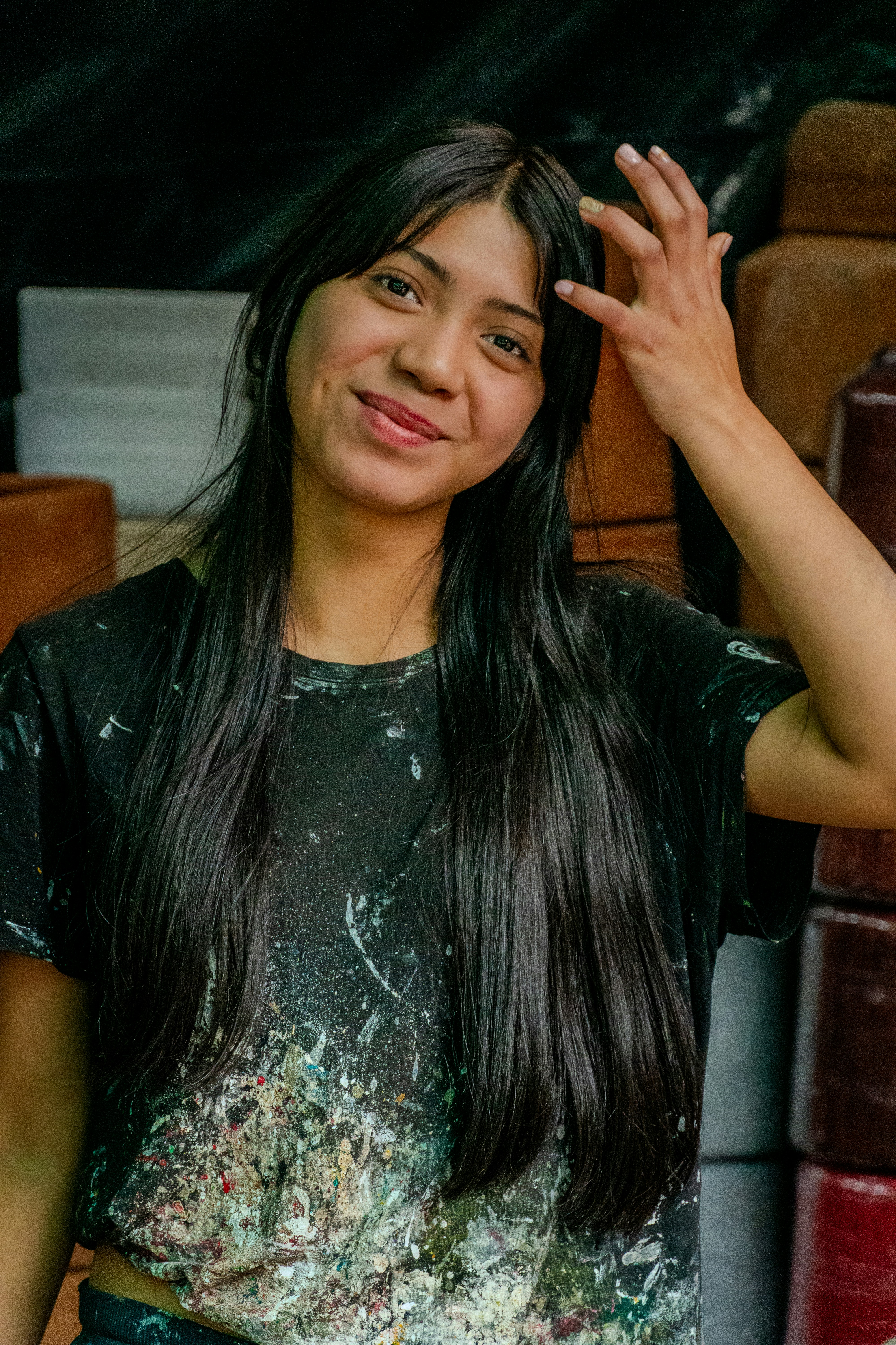 Young woman with long dark hair smiling