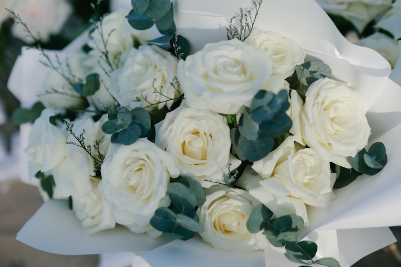 Wedding bouquet of white roses and eucalyptus