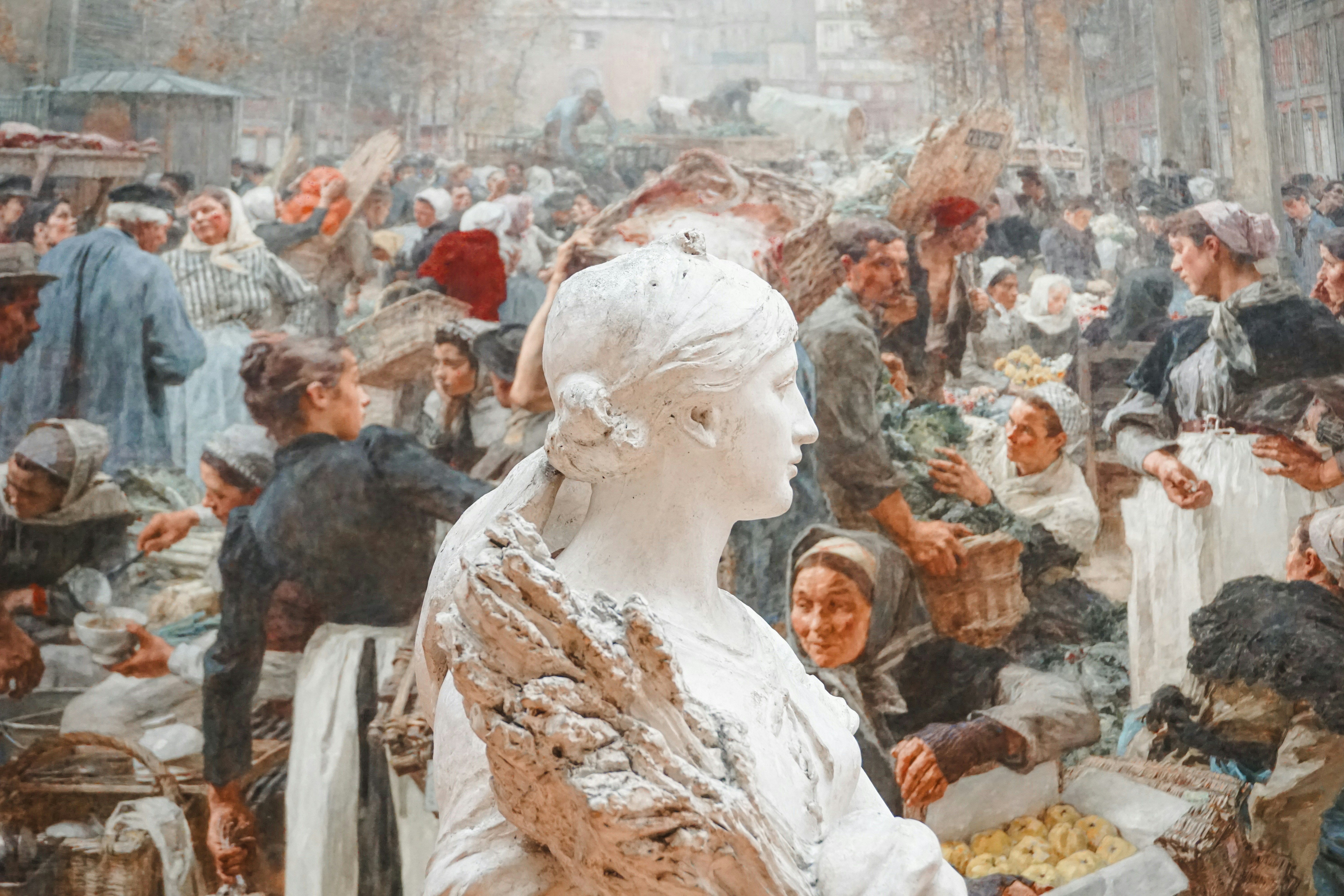 Marble bust in a bustling historical marketplace scene