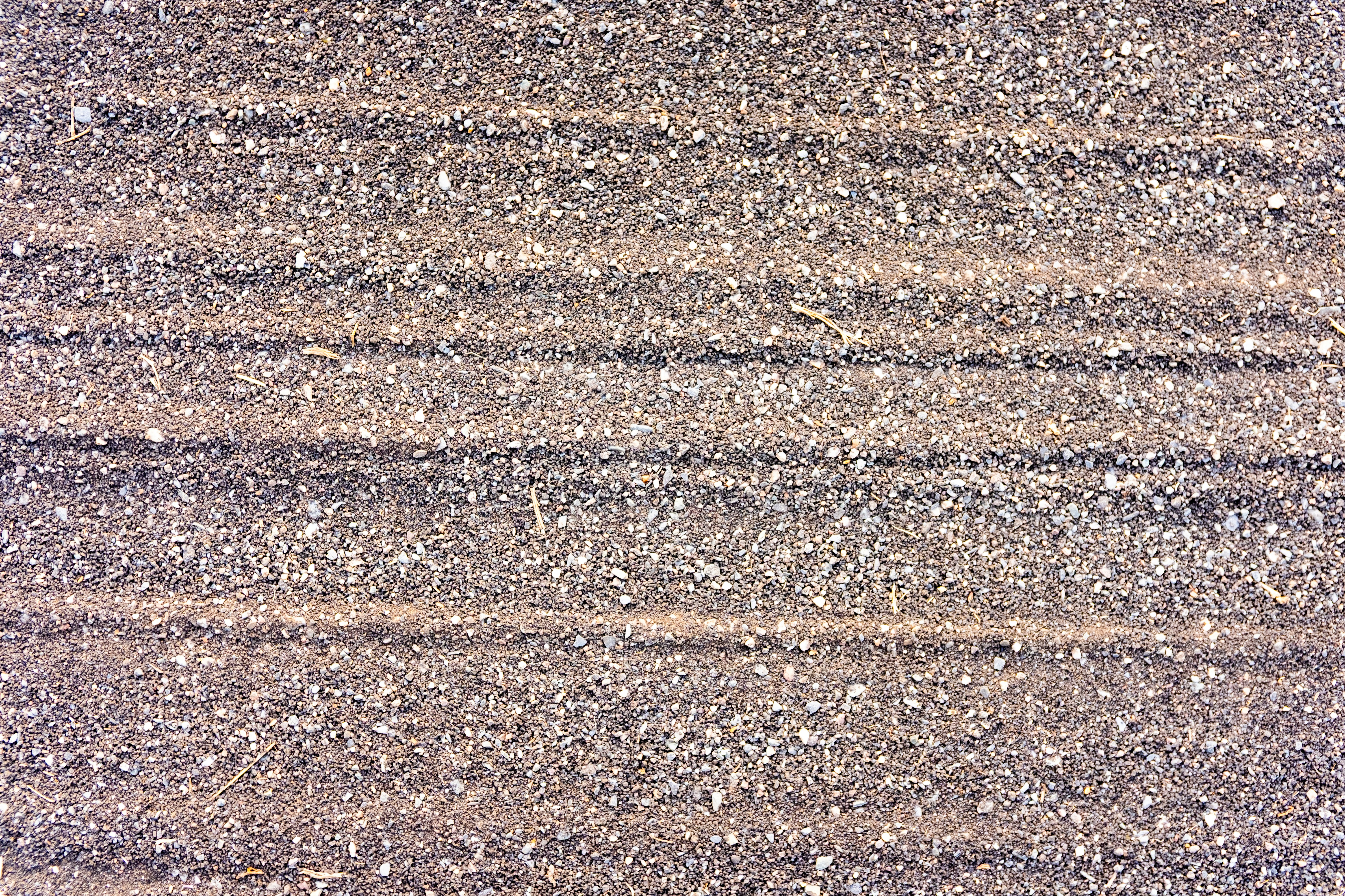 Close-up of asphalt road texture with horizontal lines