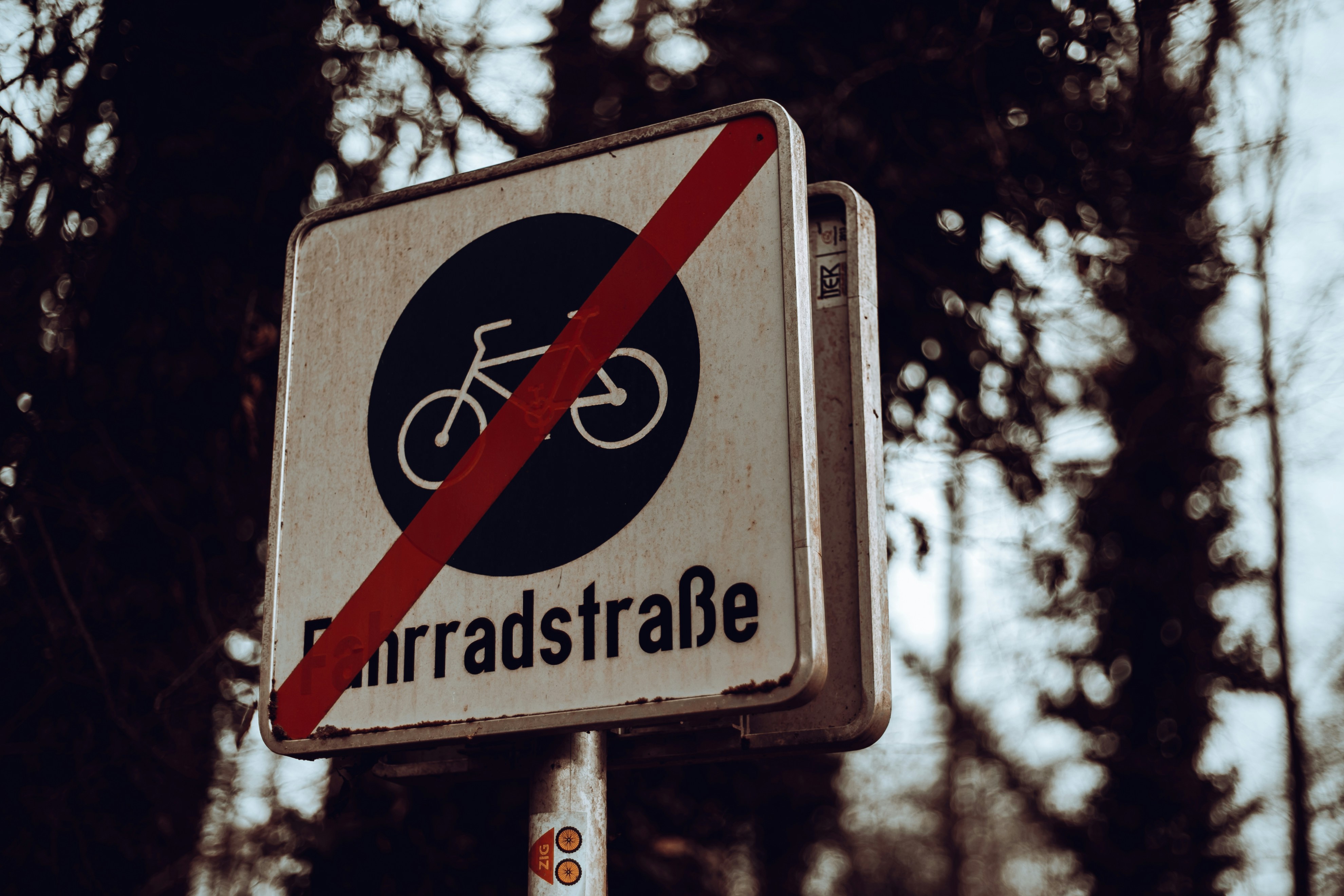 End of bike path sign with red slash