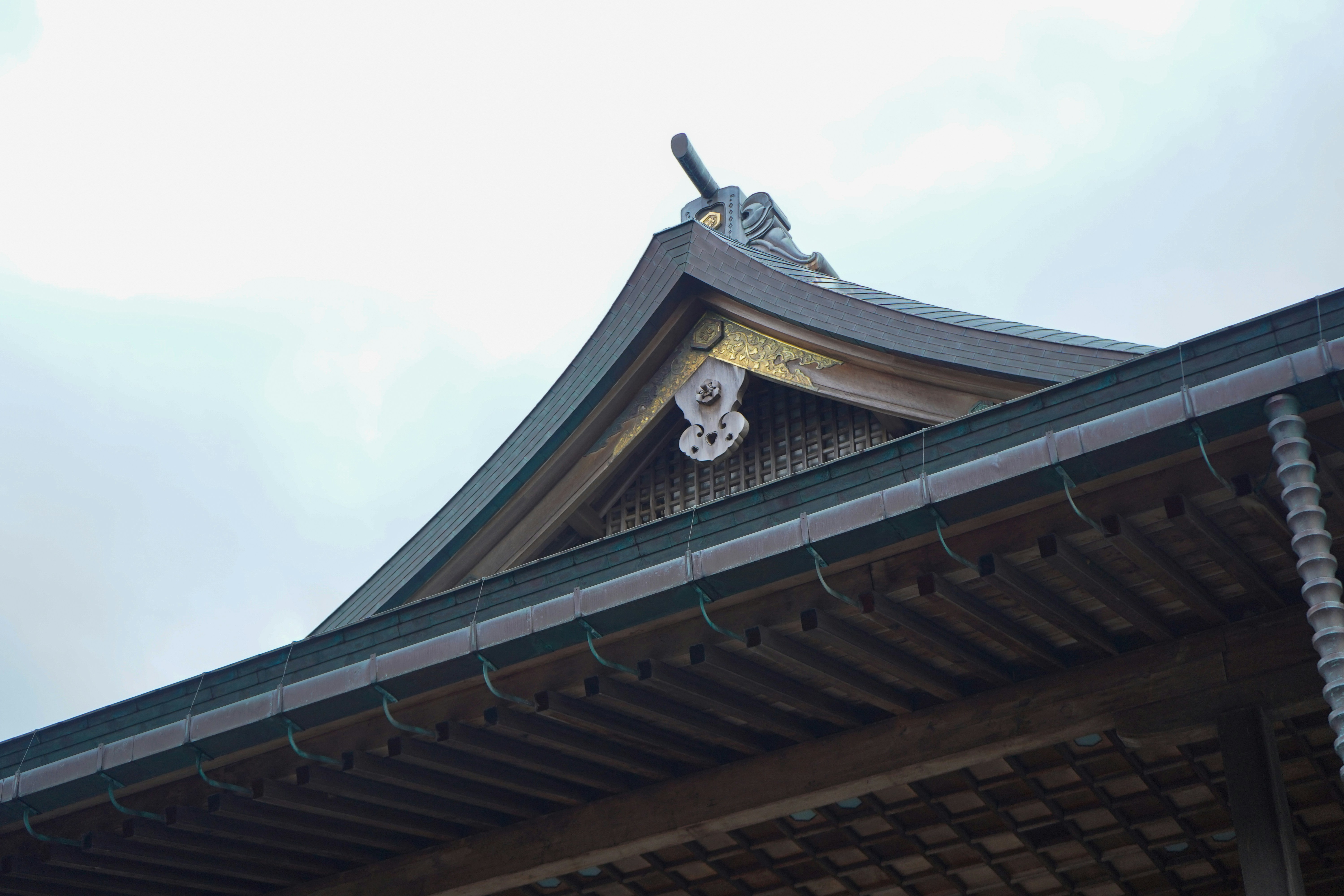 Japanese temple roof with intricate 'onigawara' finials - roof finials