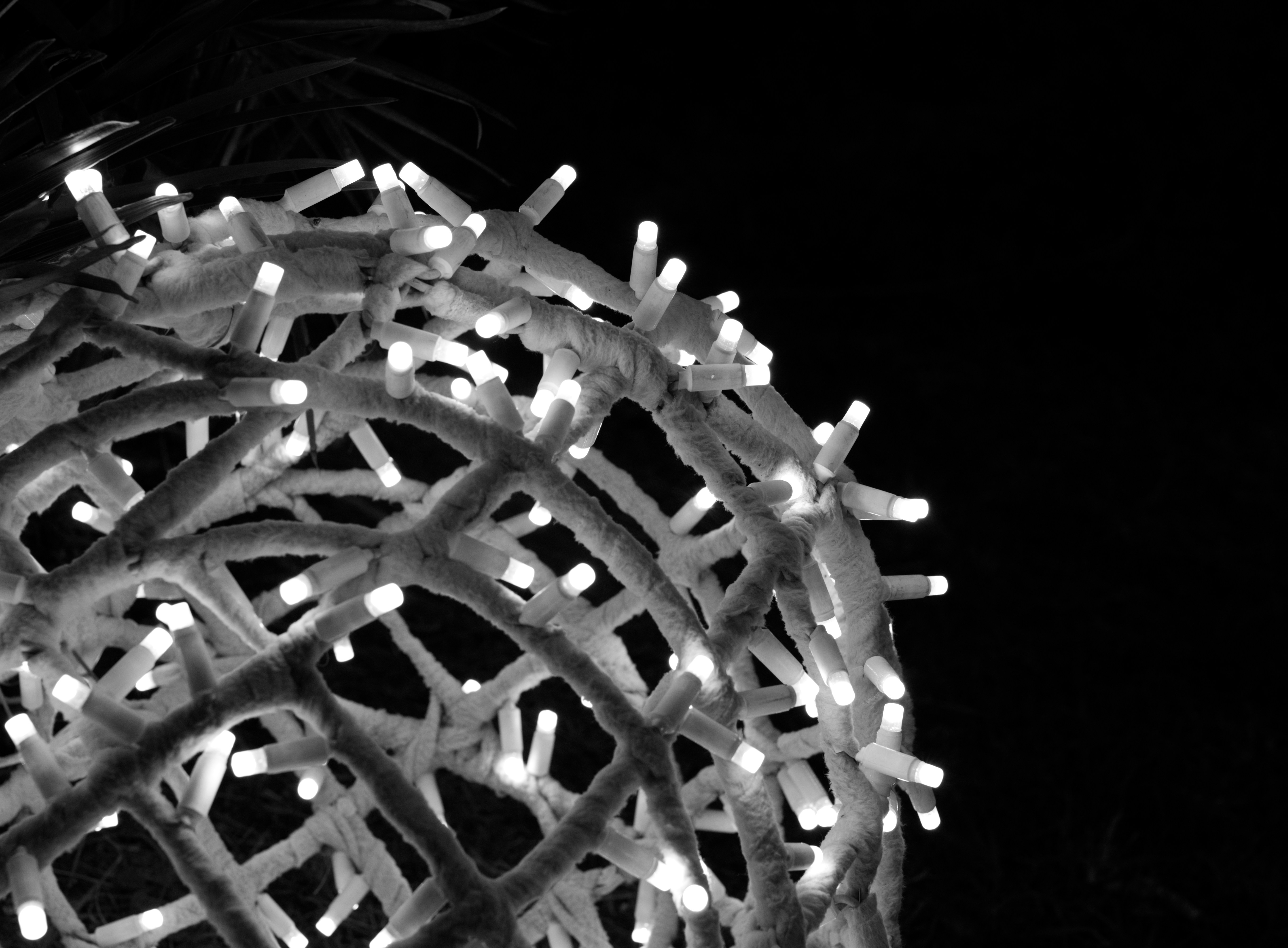 Close-up of a spherical light decoration at night
