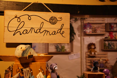 Wooden sign with "handmade" written on it.