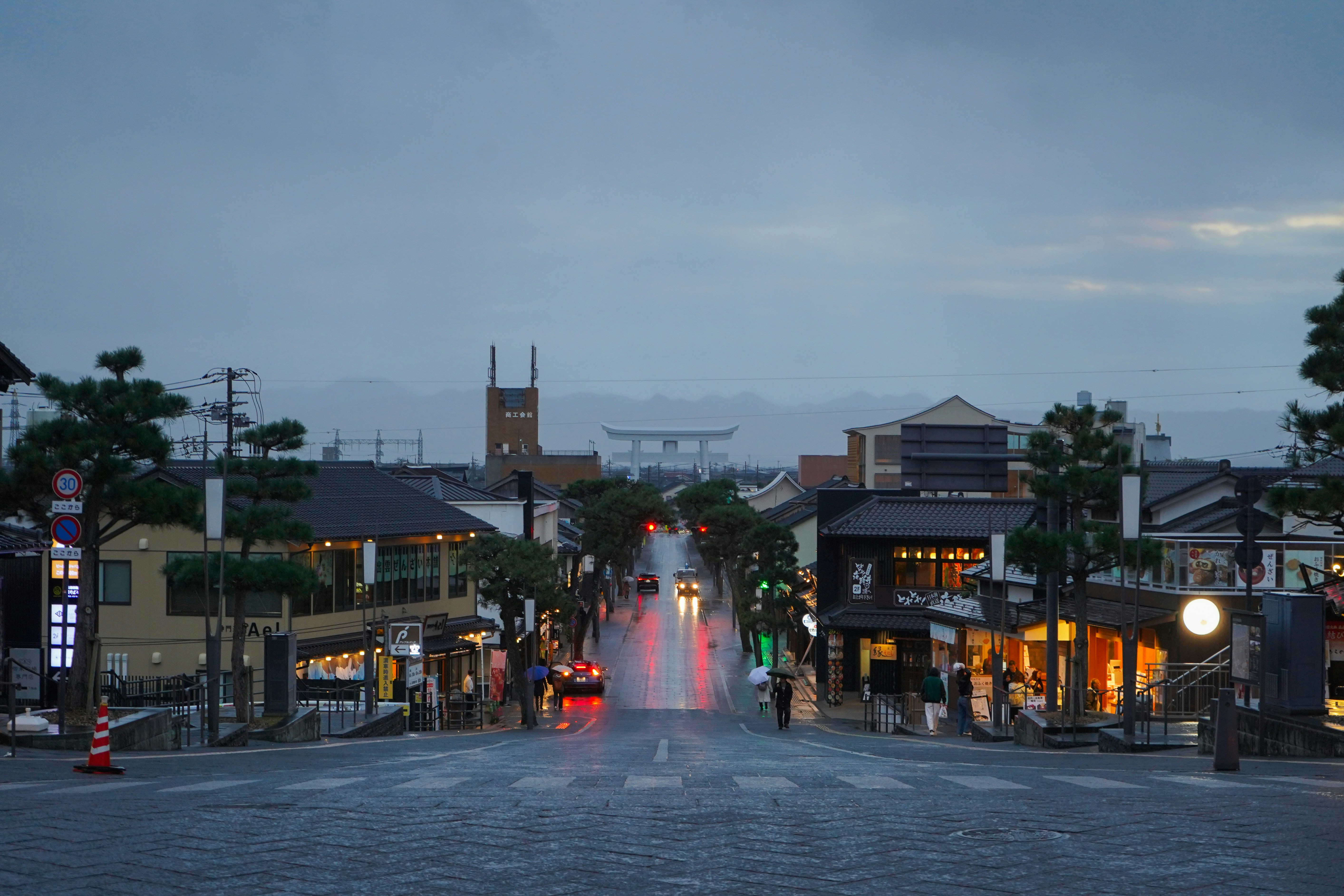 Wet street in a town at dusk