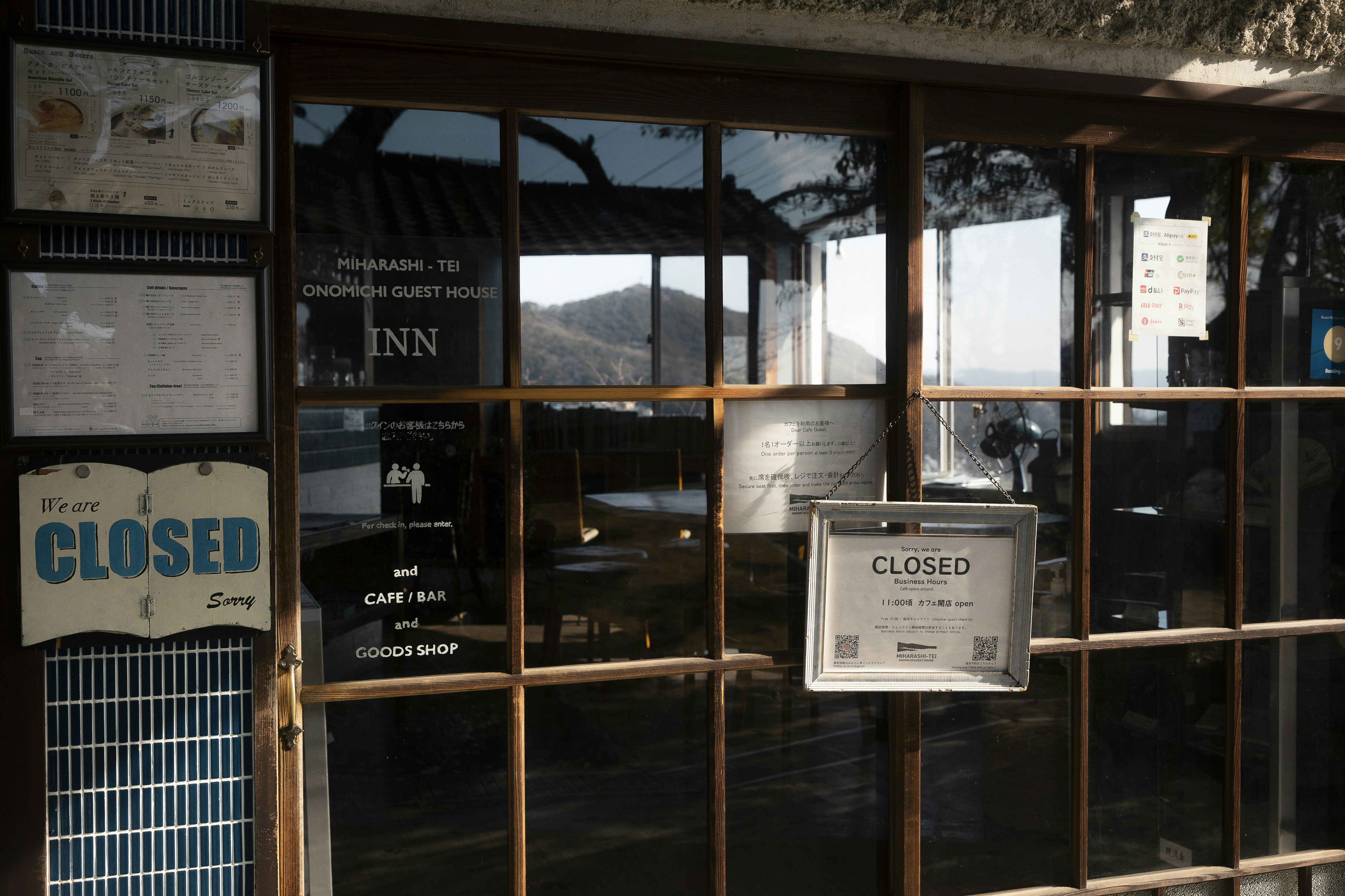 Inn with closed signs on glass door