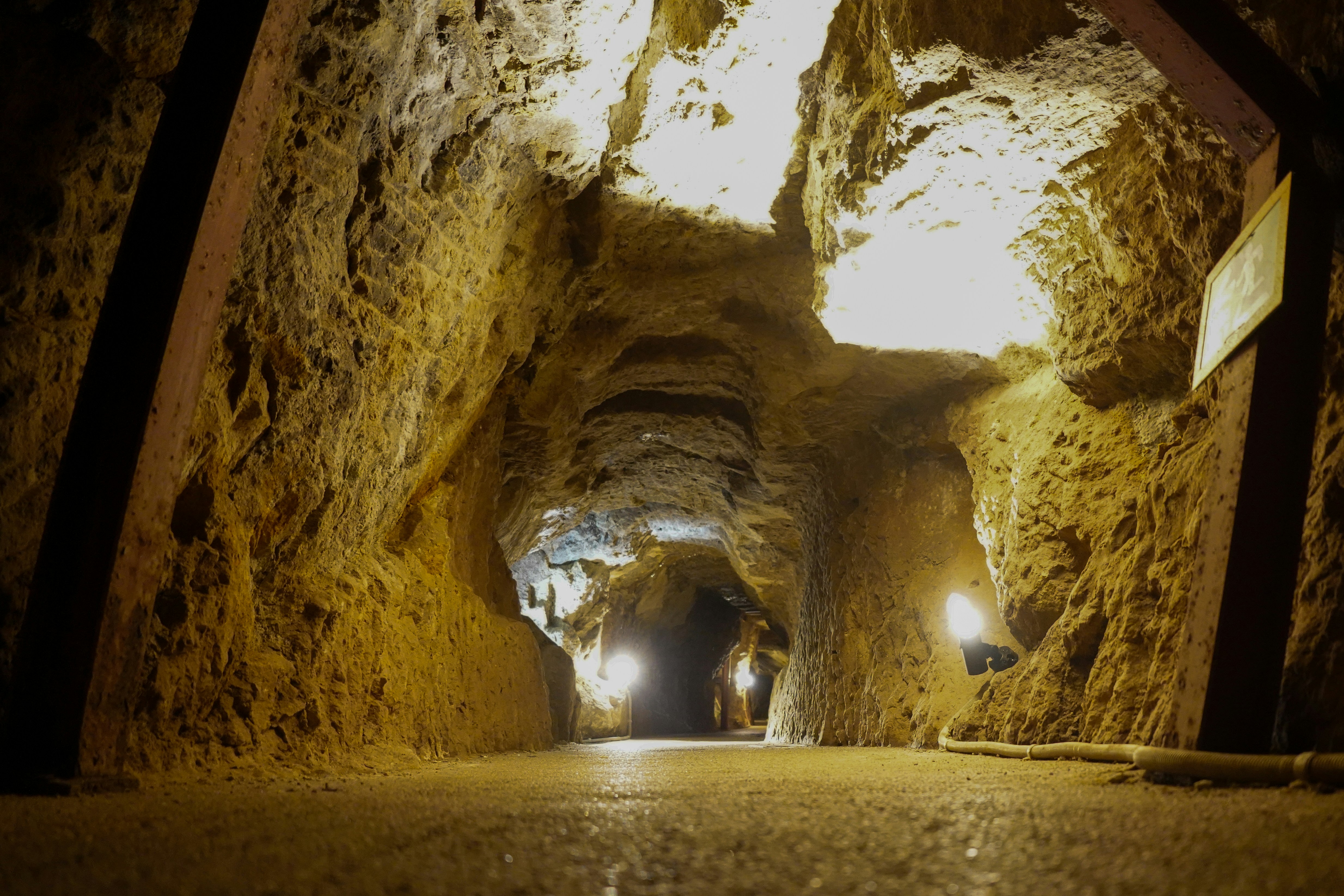 Ancient Mine Tunnel Illuminated by Warm Lights