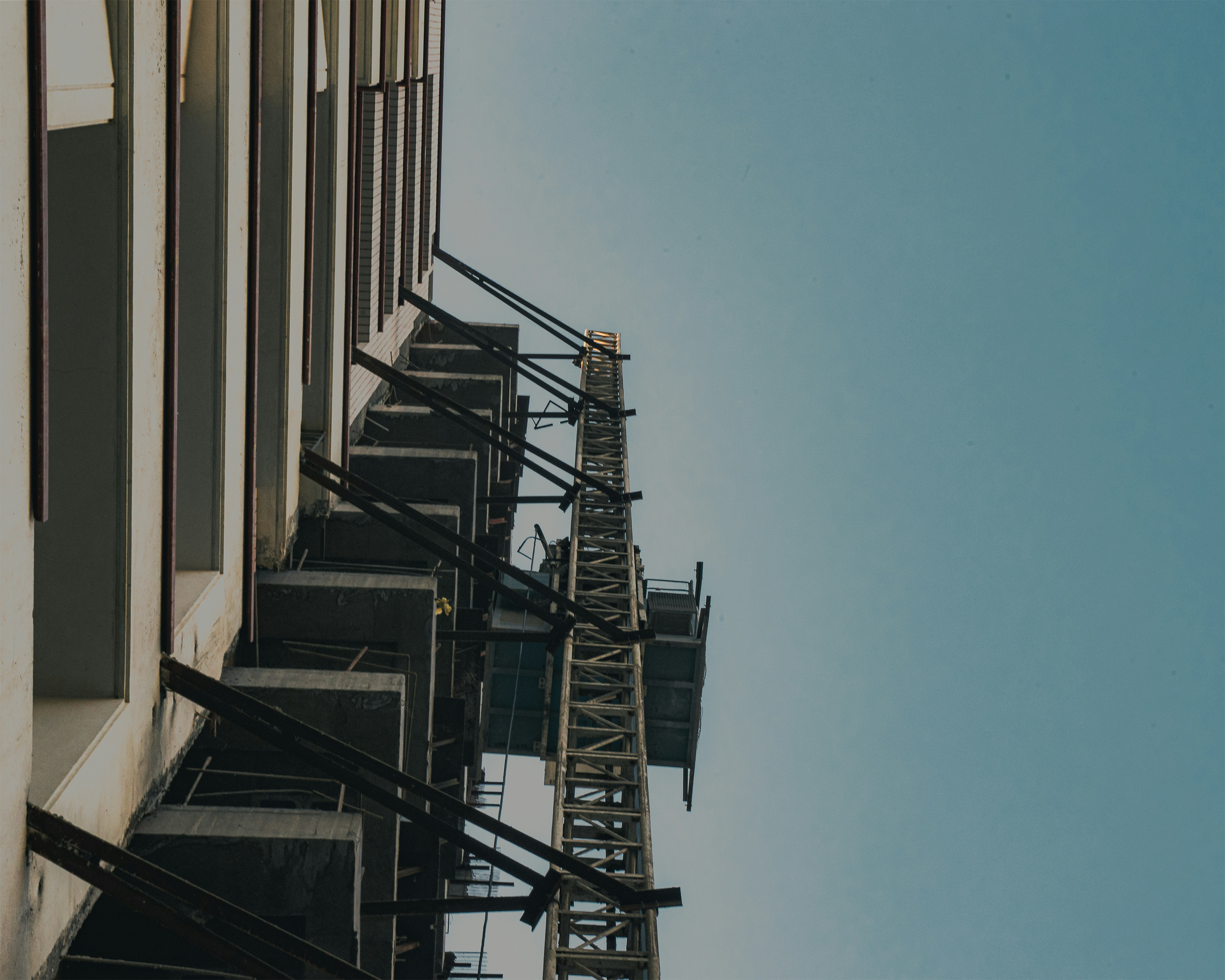Building exterior with scaffolding against clear sky