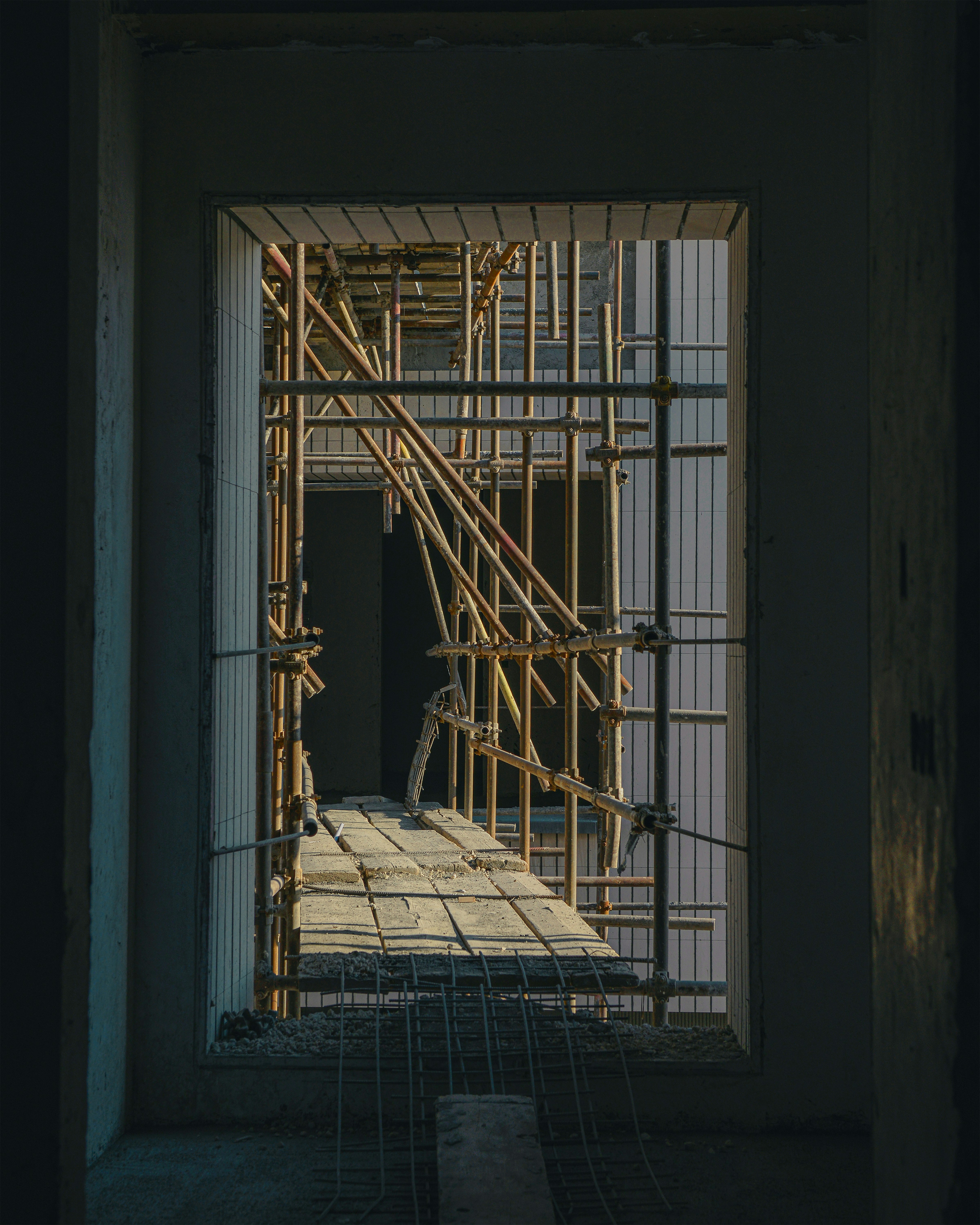 Construction site with scaffolding and wooden planks