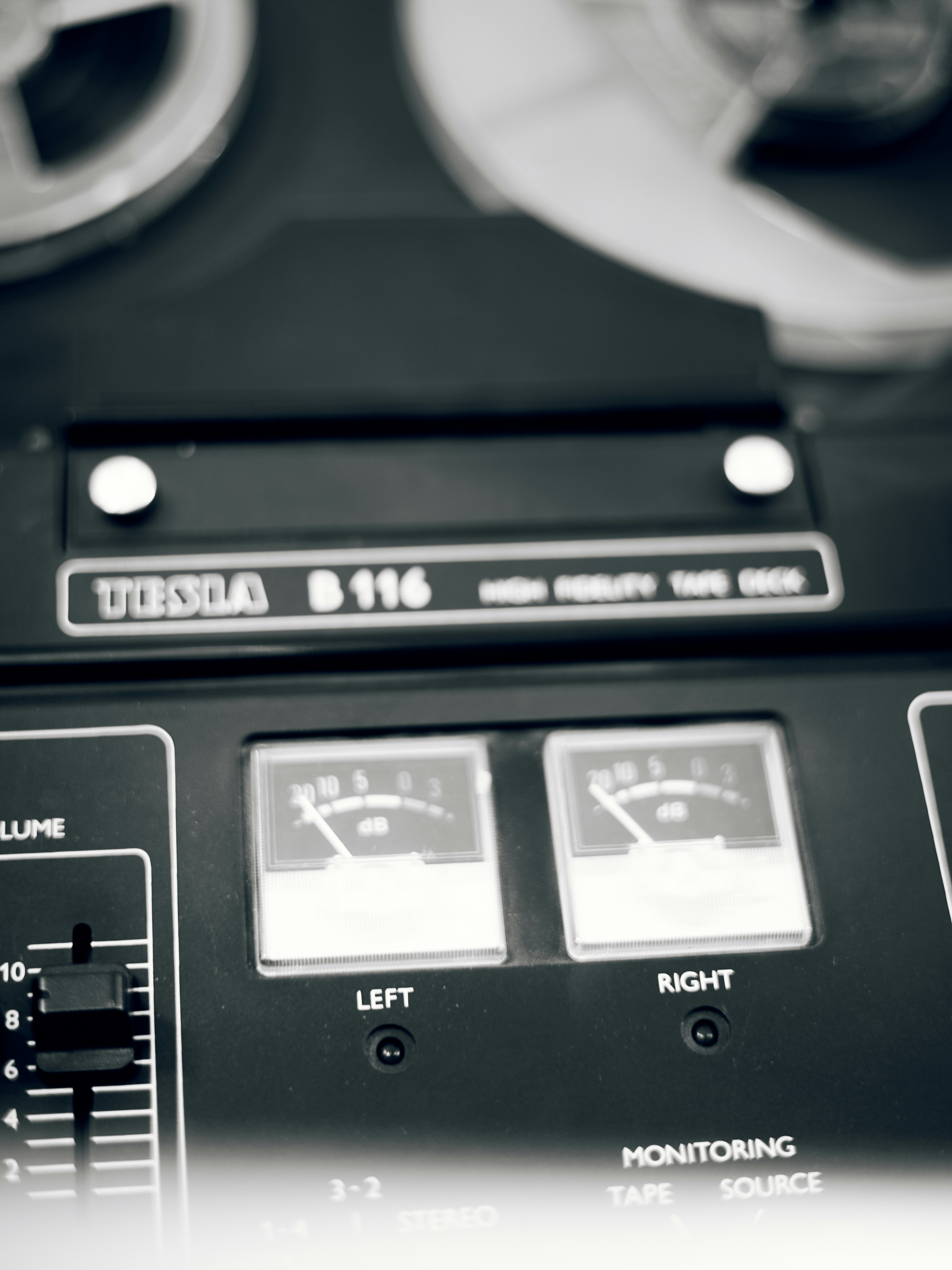 Vintage reel-to-reel tape recorder with vu meters