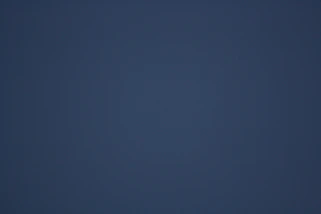 A dark blue gradient background