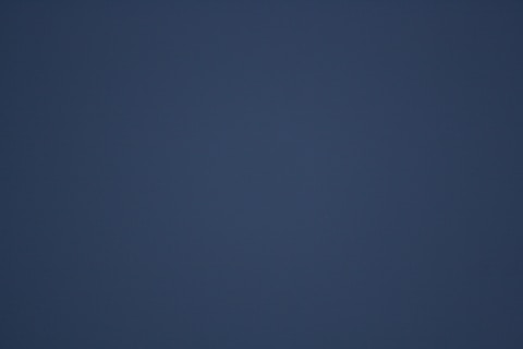 A dark blue gradient background