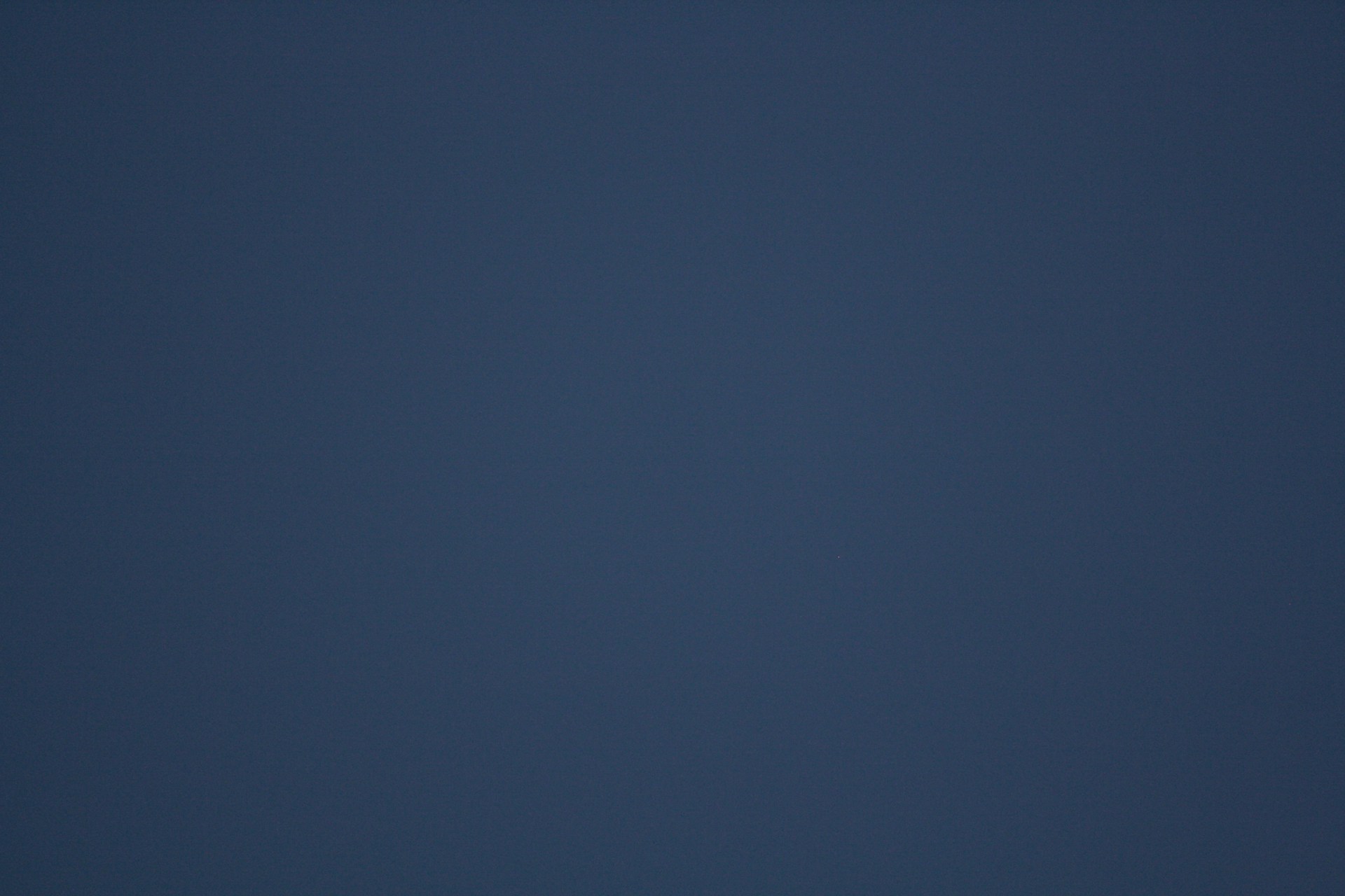 A dark blue gradient background