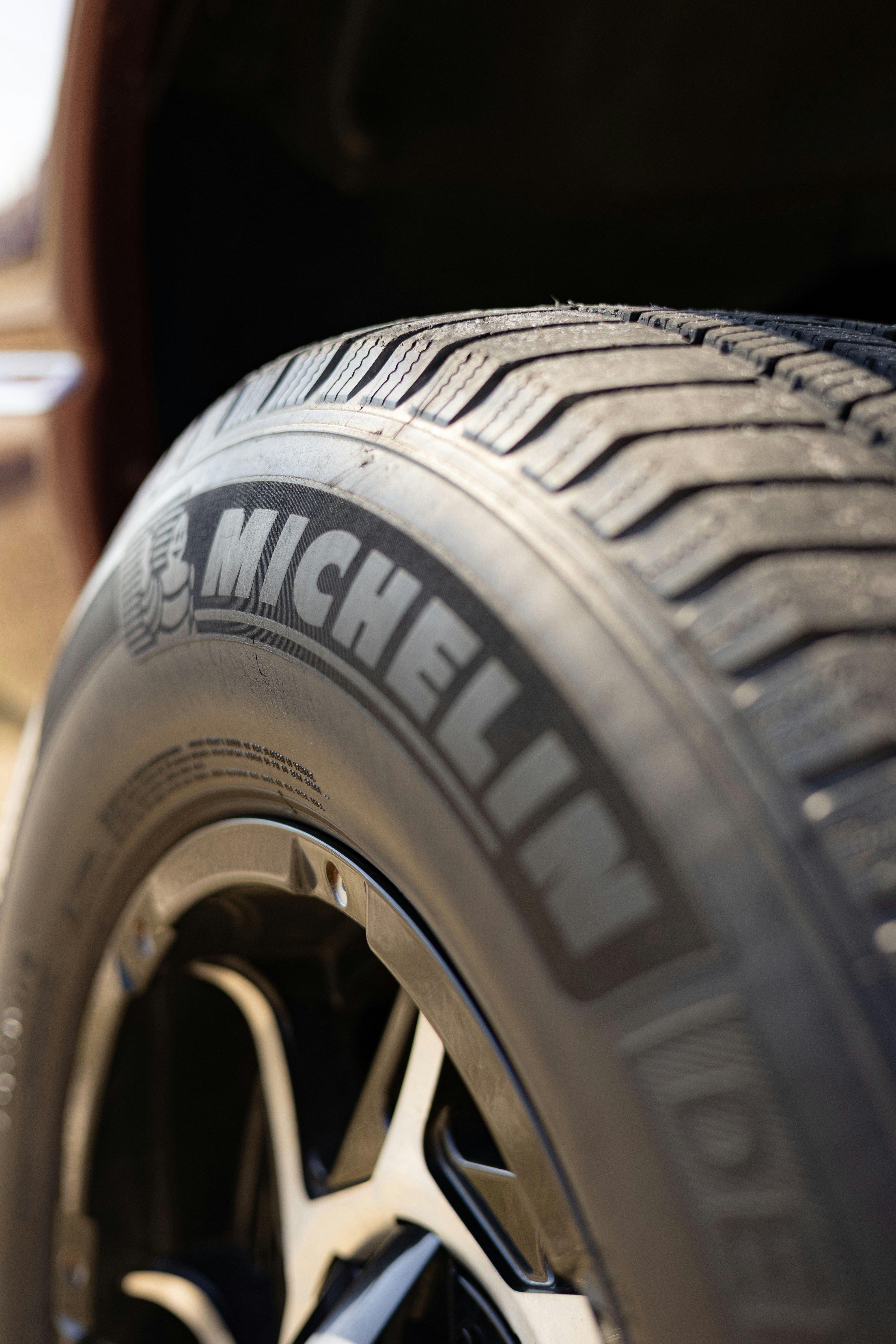 Close-up of a michelin tire on a car wheel.