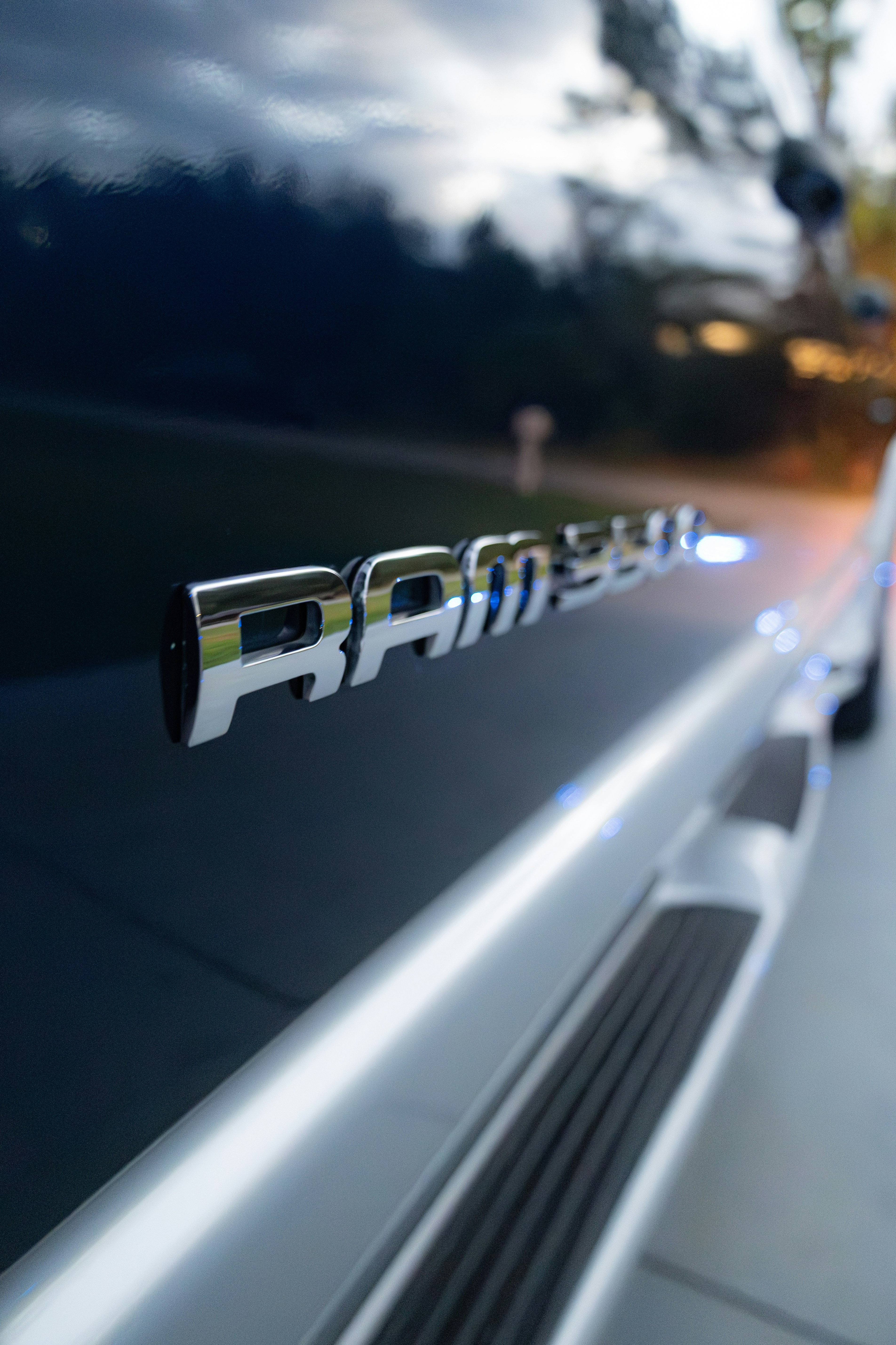Chrome ram lettering on a dark blue vehicle