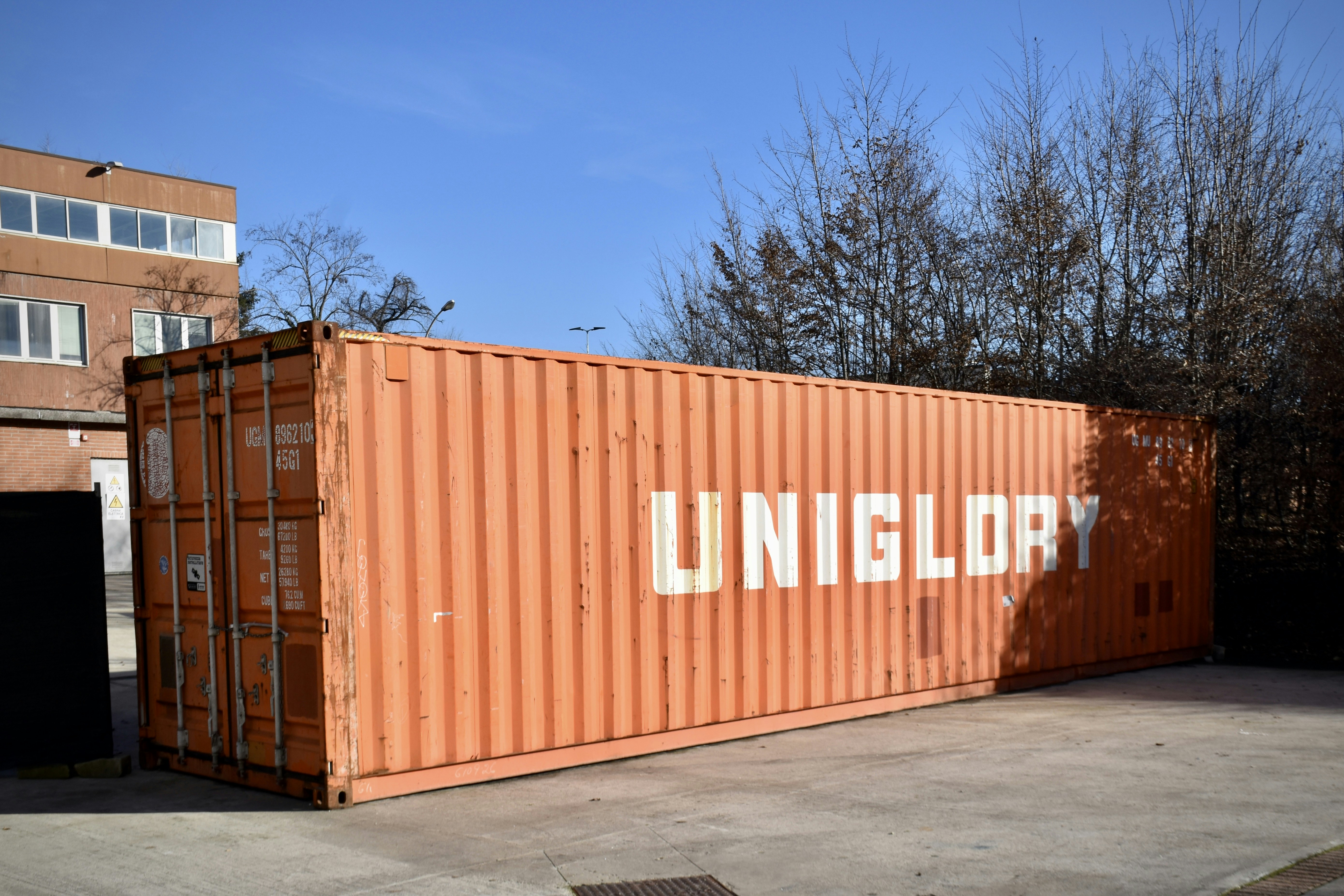 Orange shipping container with uniglory logo