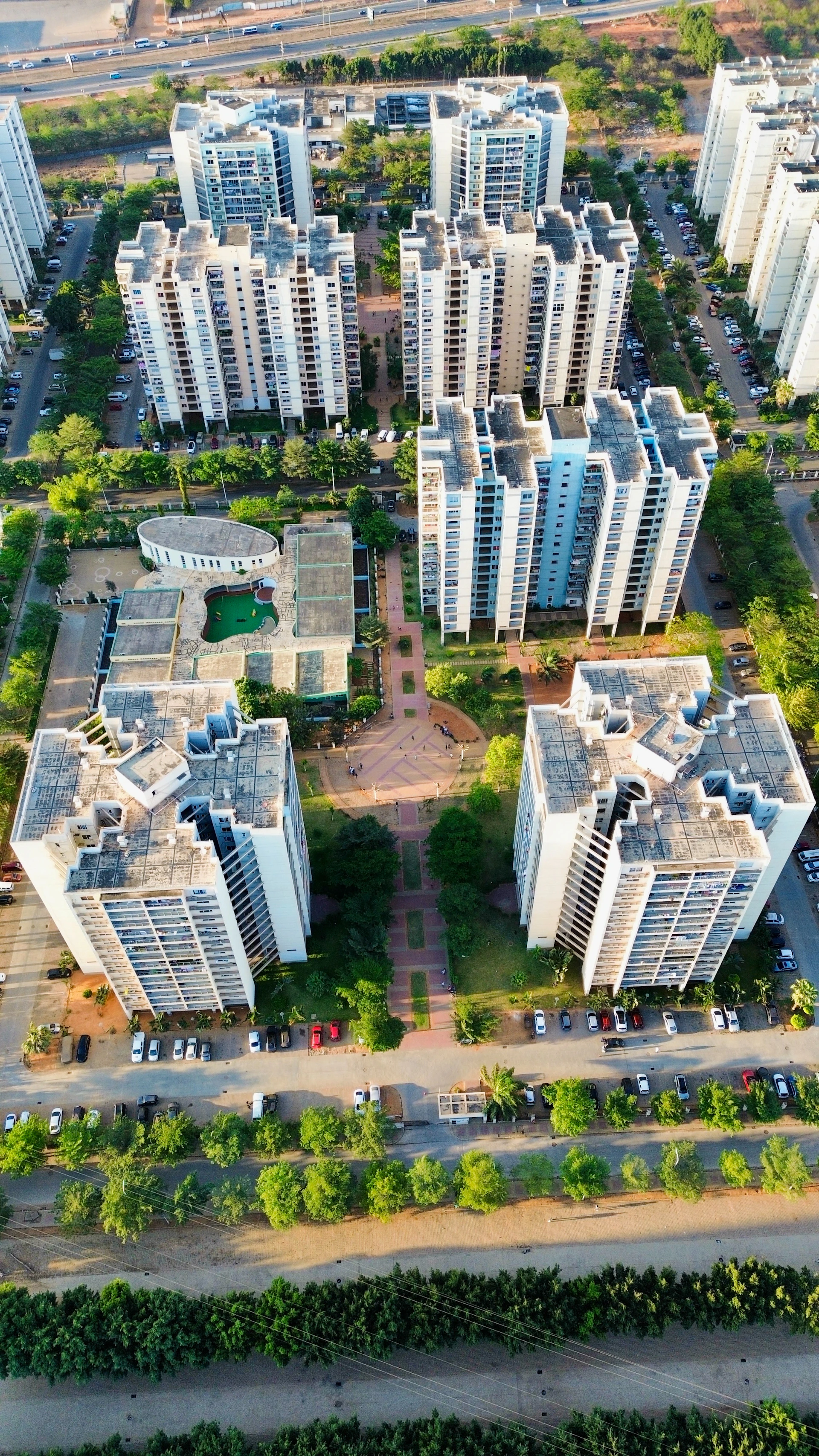 Aerial view of apartment buildings and green spaces