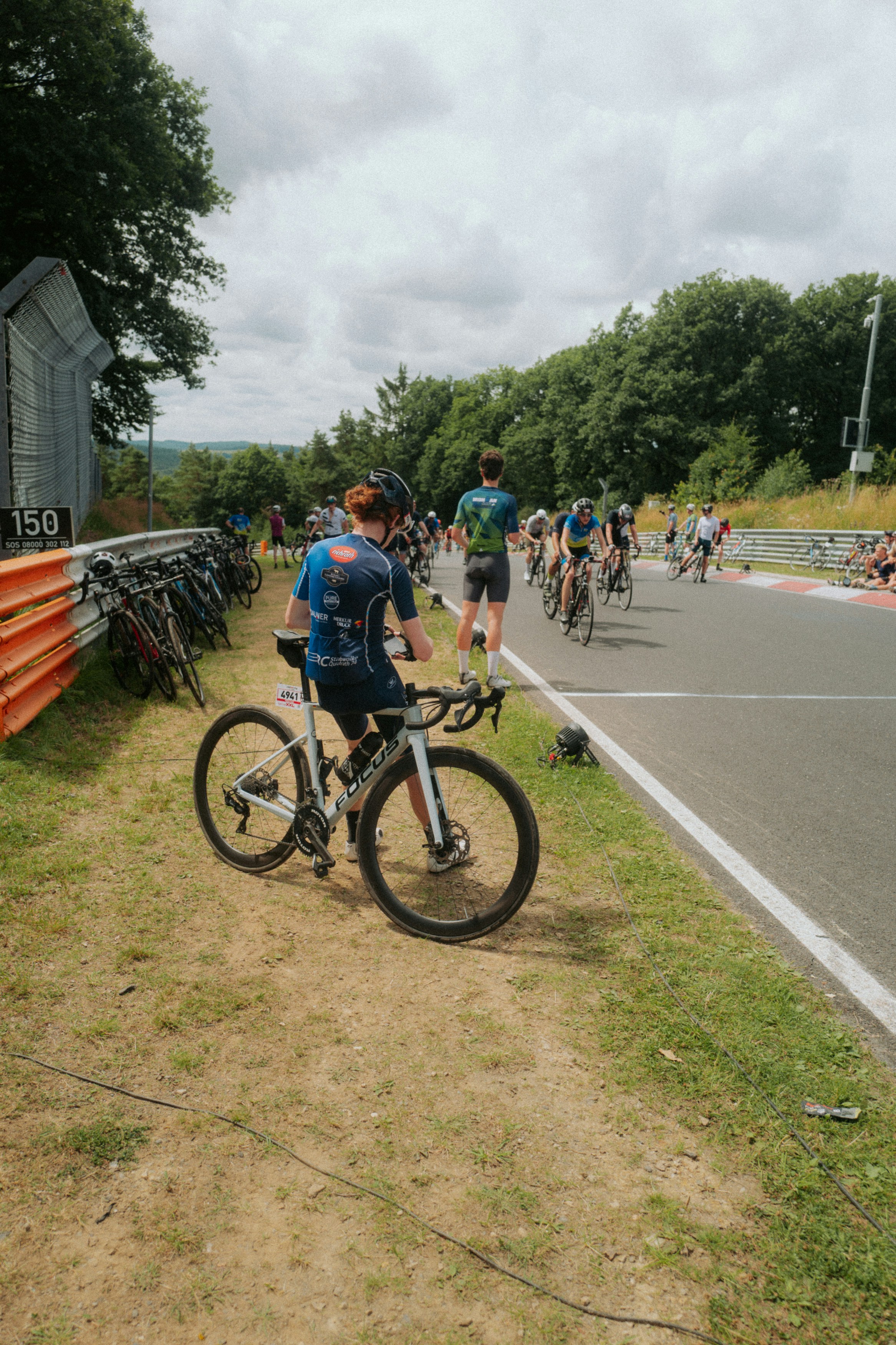 Cyclists line up at the start of a race.